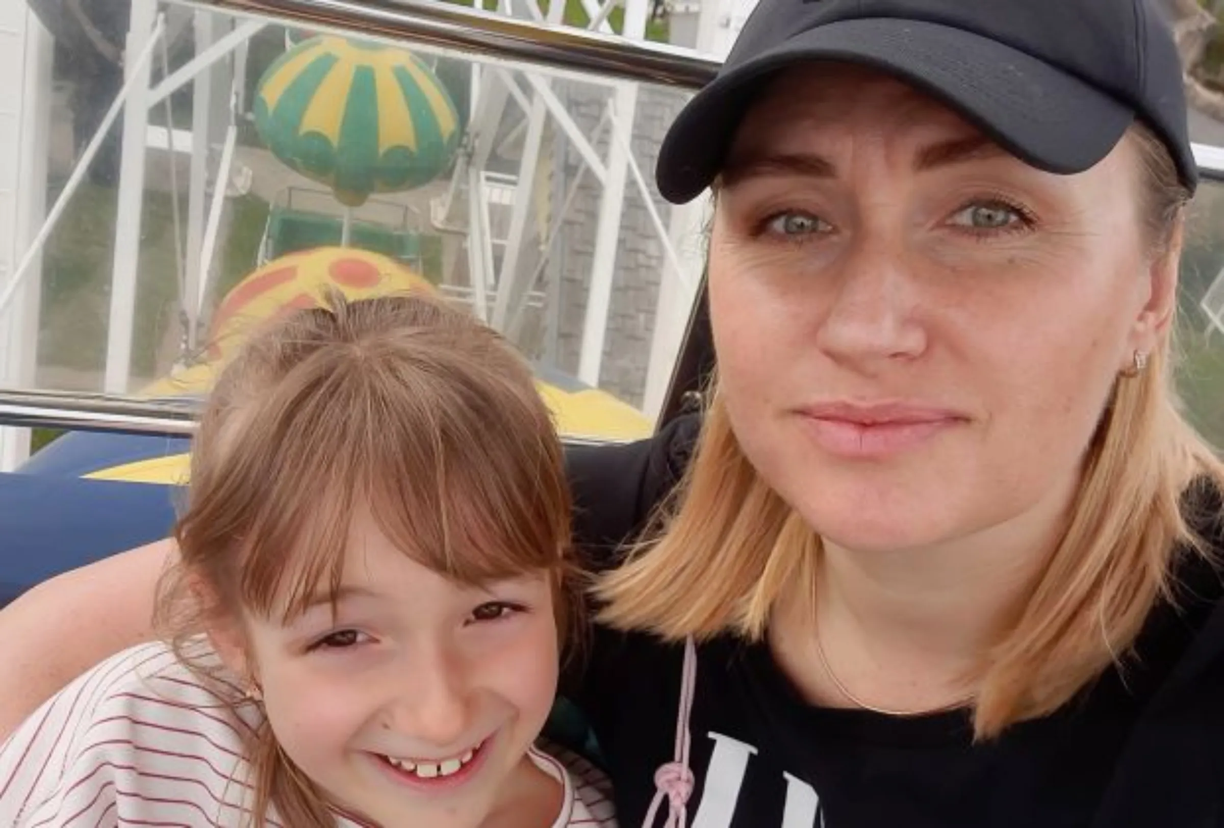 Former Ukrainian Olympic rower Tatyana Kolesnikova is pictured with her daughter at an amusement park in northern France. Thomson Reuters Foundation/Tatyana Kolesnikova