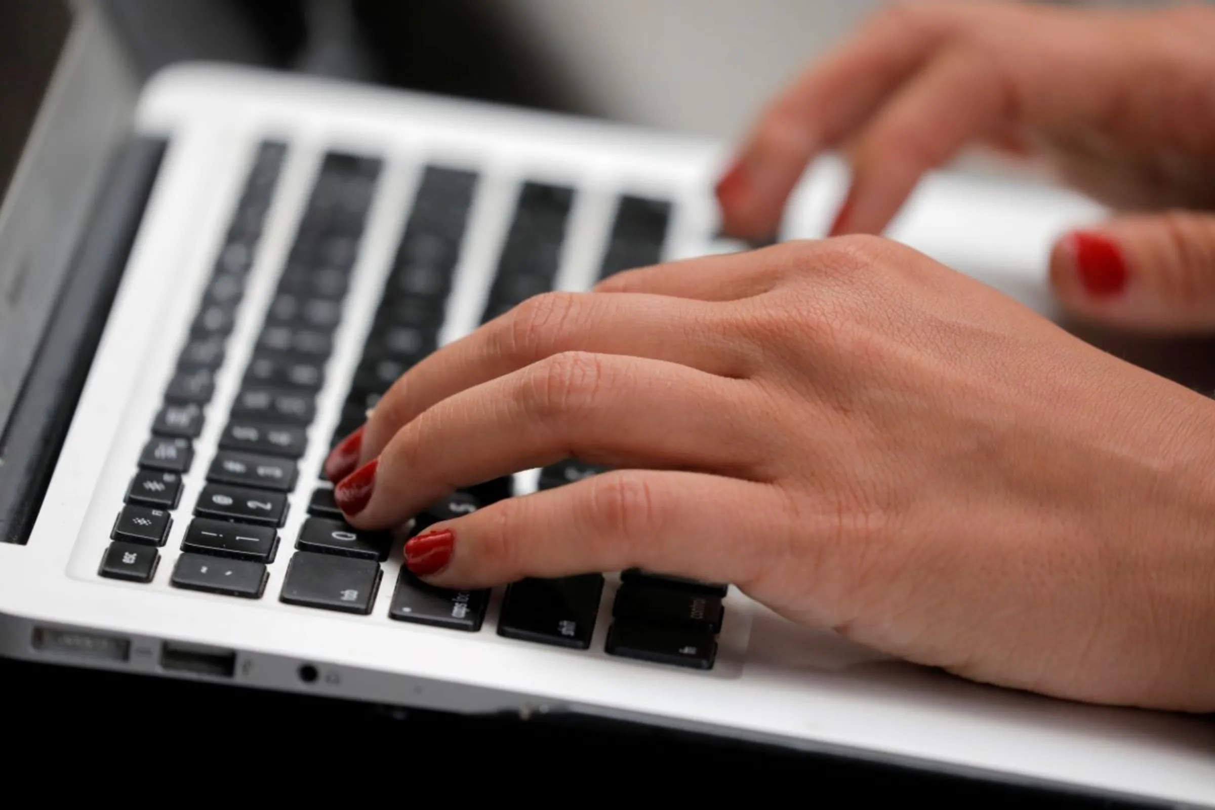 A person types on a laptop computer in Manhattan, New York City, U.S., September 11, 2020. REUTERS/Andrew Kelly