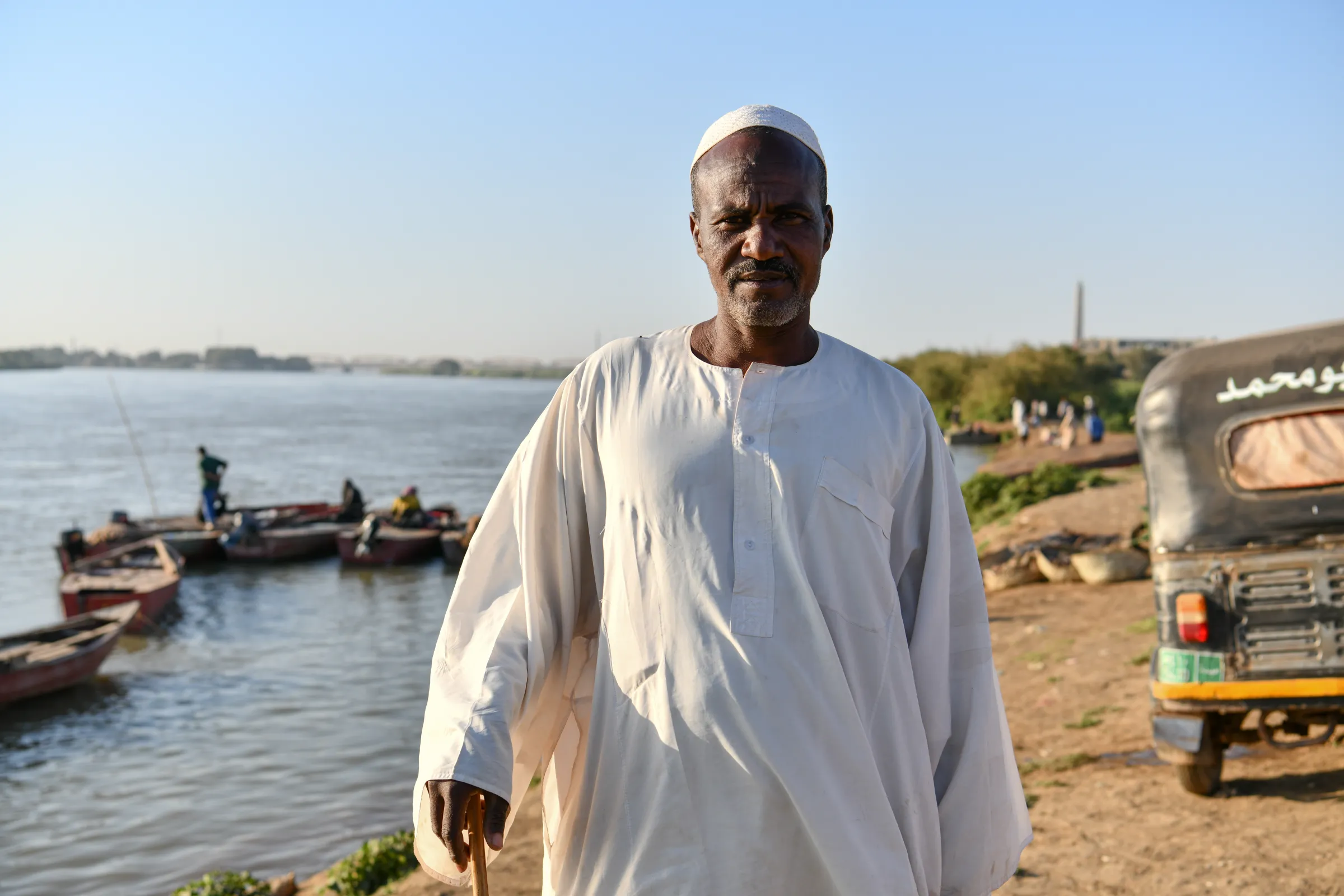 Al-Nimeiry Musa Mohammad, 45, a Sudanese fisherman who has been working on the Nile for twenty-five years, poses for a portrait by the Nile River bank in Omdurman, Sudan, February 11, 2023. Thomson Reuters Foundation/Ela Yokes