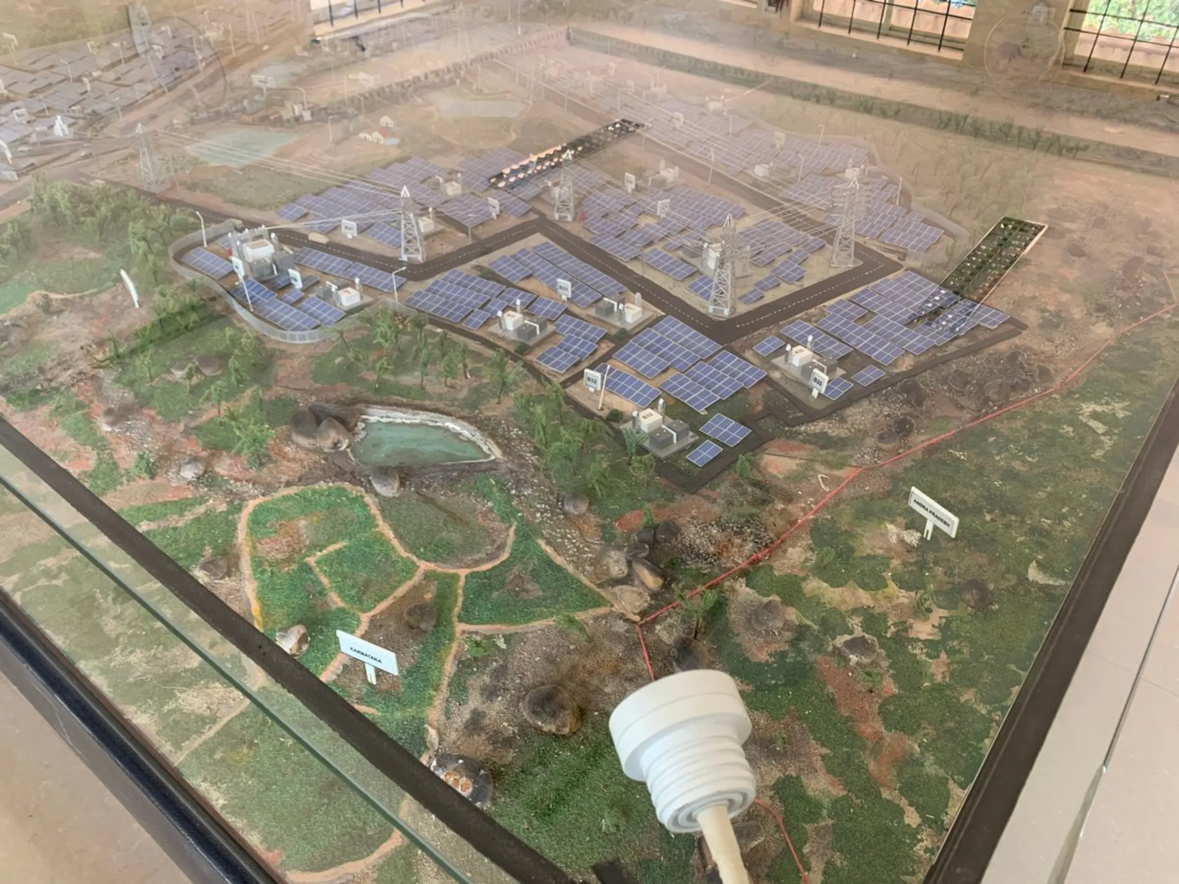 A model of the Shakti Sthala solar park on display at the office of the Karnataka State Power Development Corporation Limited in Pavagada, India, December 27, 2021
