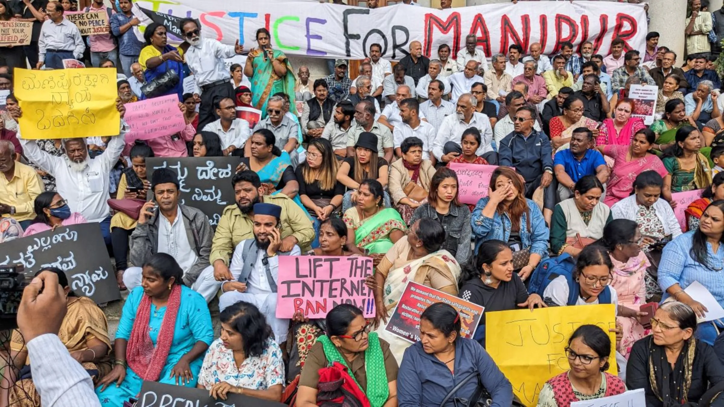 People gather outside Town Hall to protest the alleged sexual assault of two tribal women in the eastern state of Manipur, in Bengaluru, India July 21, 2023