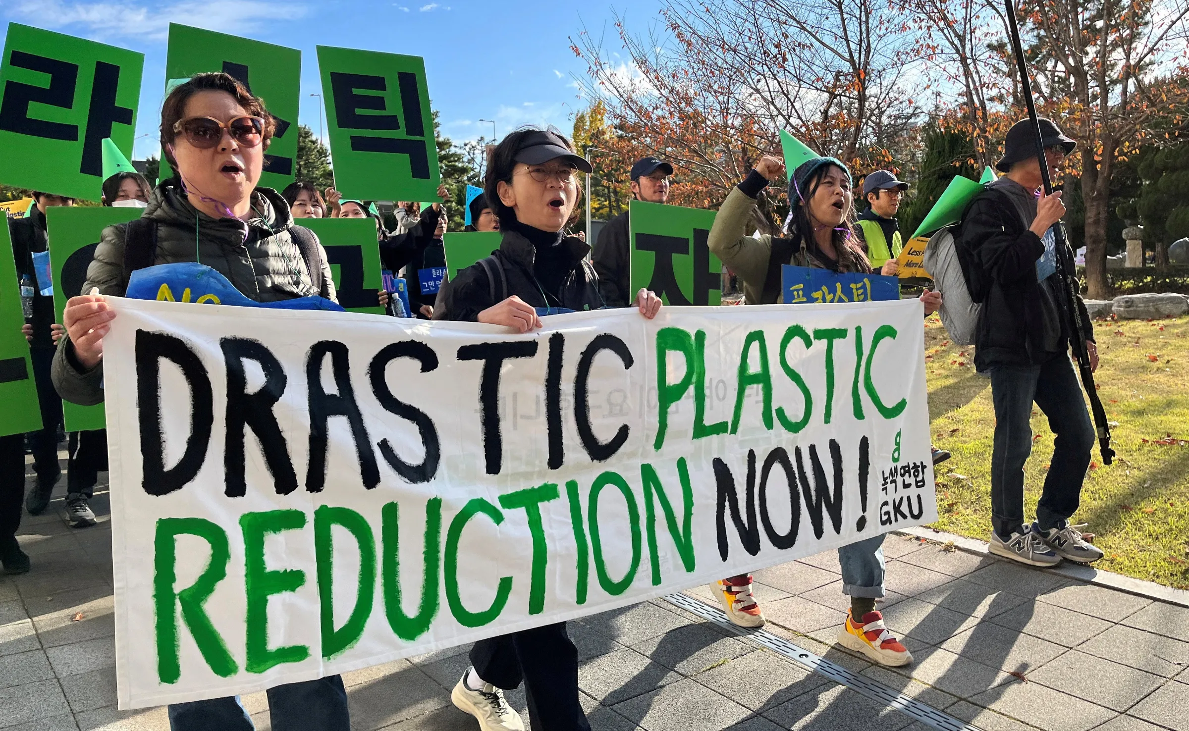 Climate activists march to demand stronger global commitments to fight plastic waste in Busan, South Korea, November 23, 2024. REUTERS/Minwoo Park