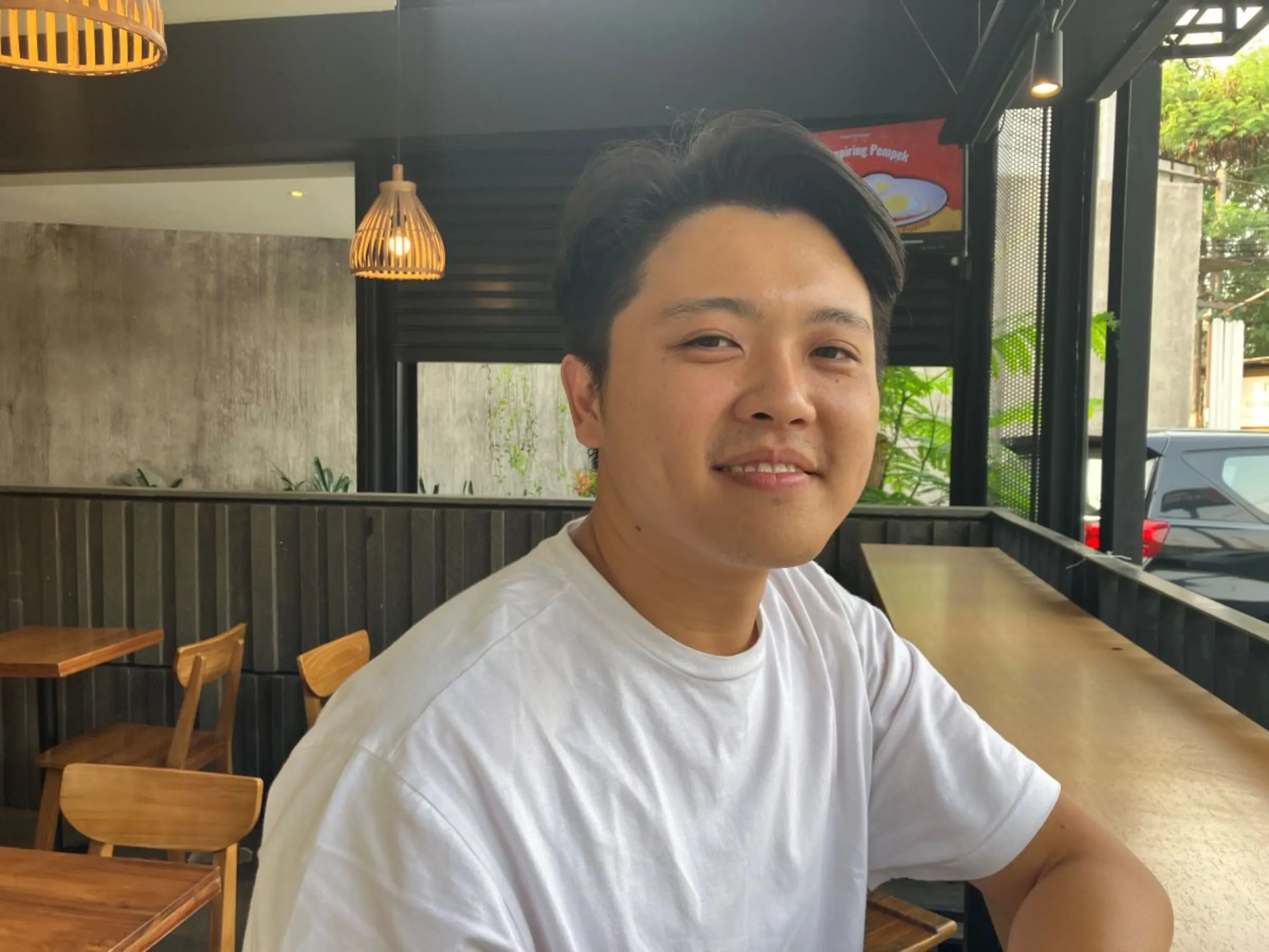 Green architect Andi Subagio inside the restaurant he designed and made using Rebricks building materials in Jakarta, Indonesia on August 12, 2023. Thomson Reuters Foundation/Michael Taylor