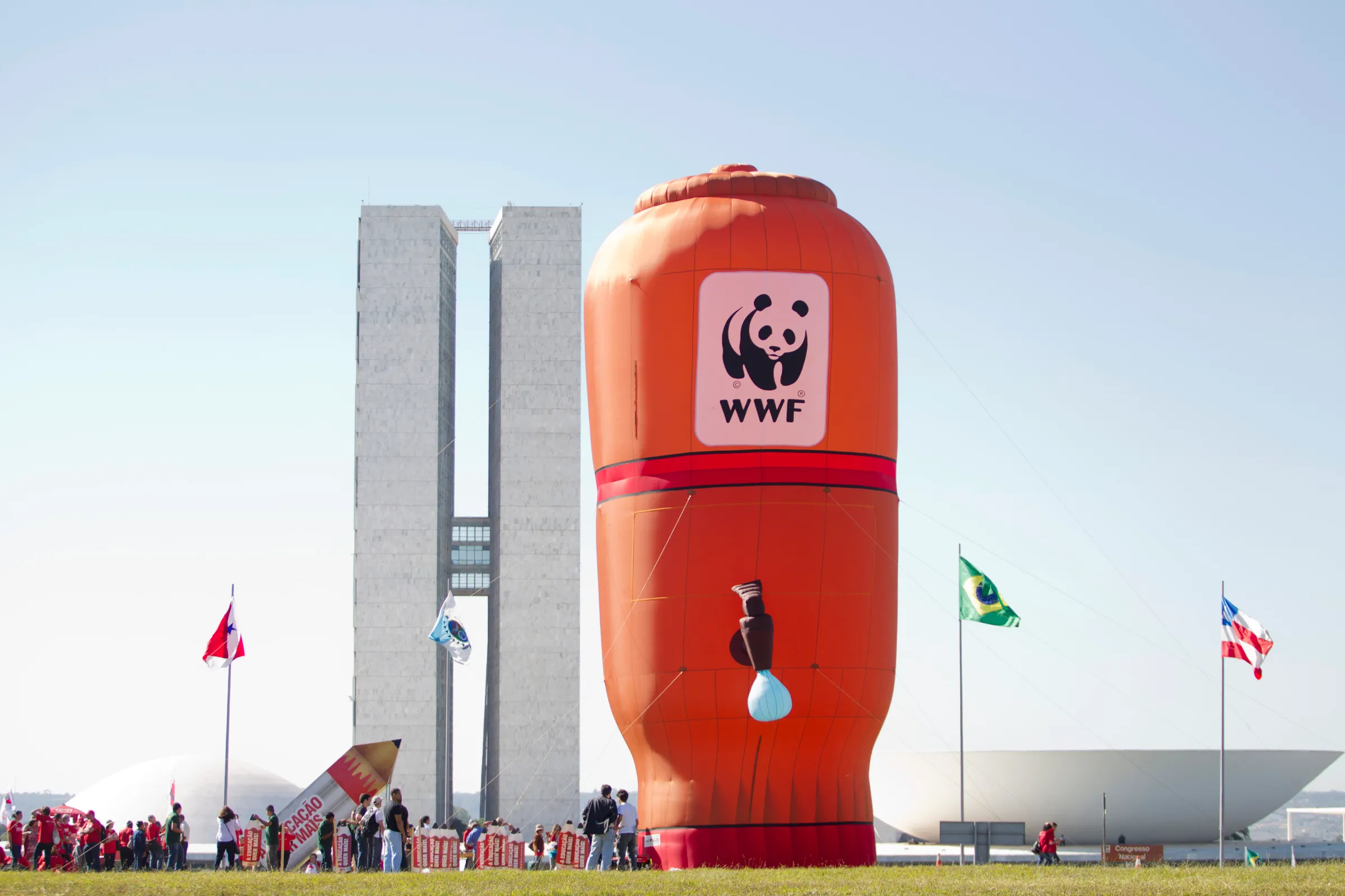 WWF members set up a balloon shaped like a water filter in front of the Brazilian National Congress, to call attention to the voting of the reform of the forestry code, in Brasilia May 11, 2011. The Forestry Code, which sets the percentage of native forest farmers must preserve, could significantly increase agricultural costs as farmers will have to reforest or invest in protected areas.