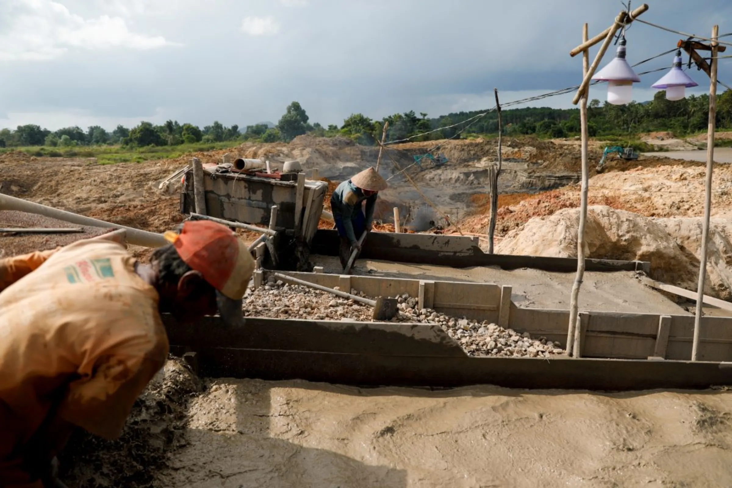 Unlicensed miners work in a tin mining area in Toboali, on the southern shores of the island of Bangka, Indonesia, April 29, 2021. REUTERS/Willy Kurniawan