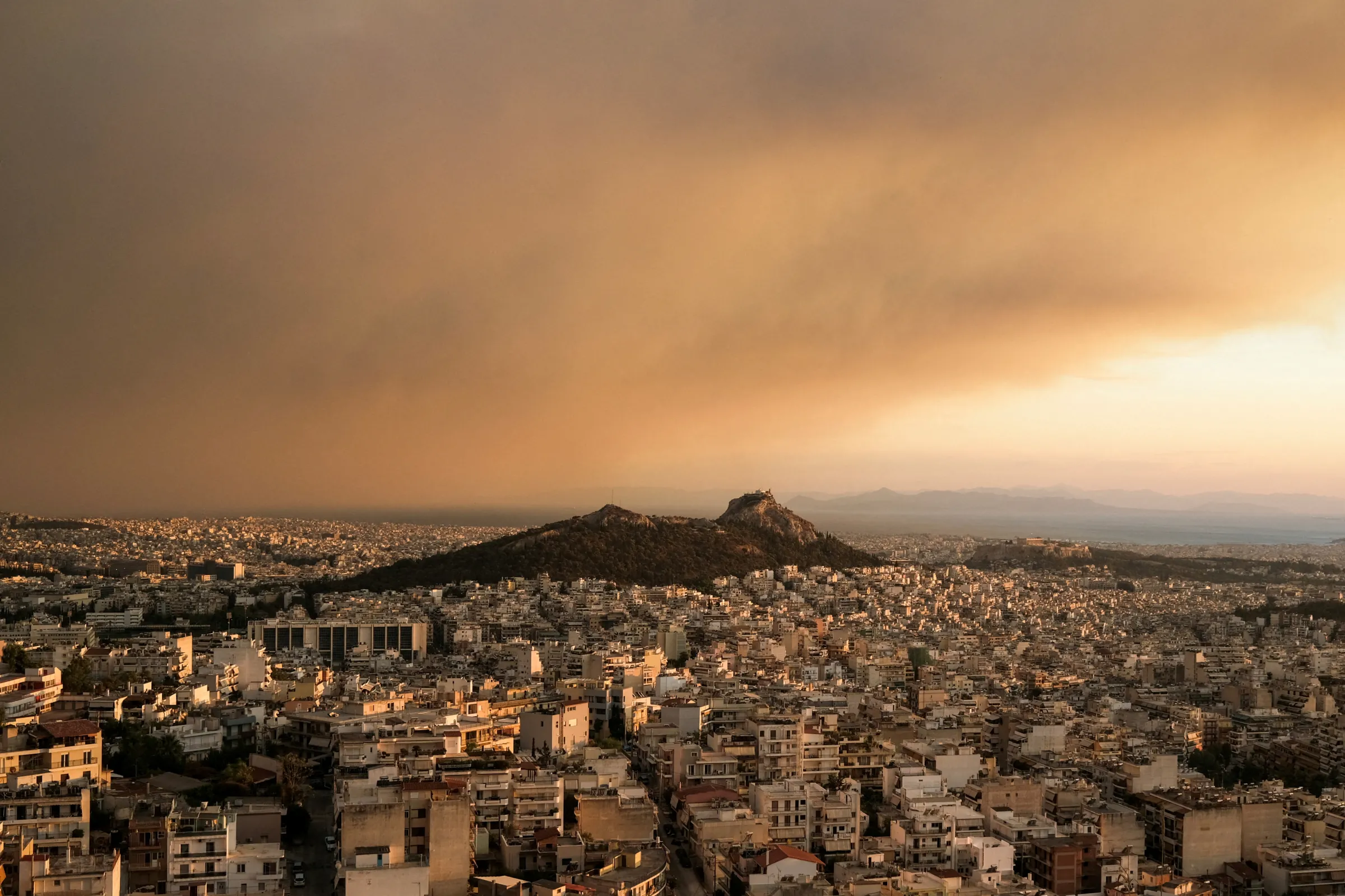 Smoke blankets Athens after a wildfire in Varnavas, August, 2024. REUTERS/Elias Marcou