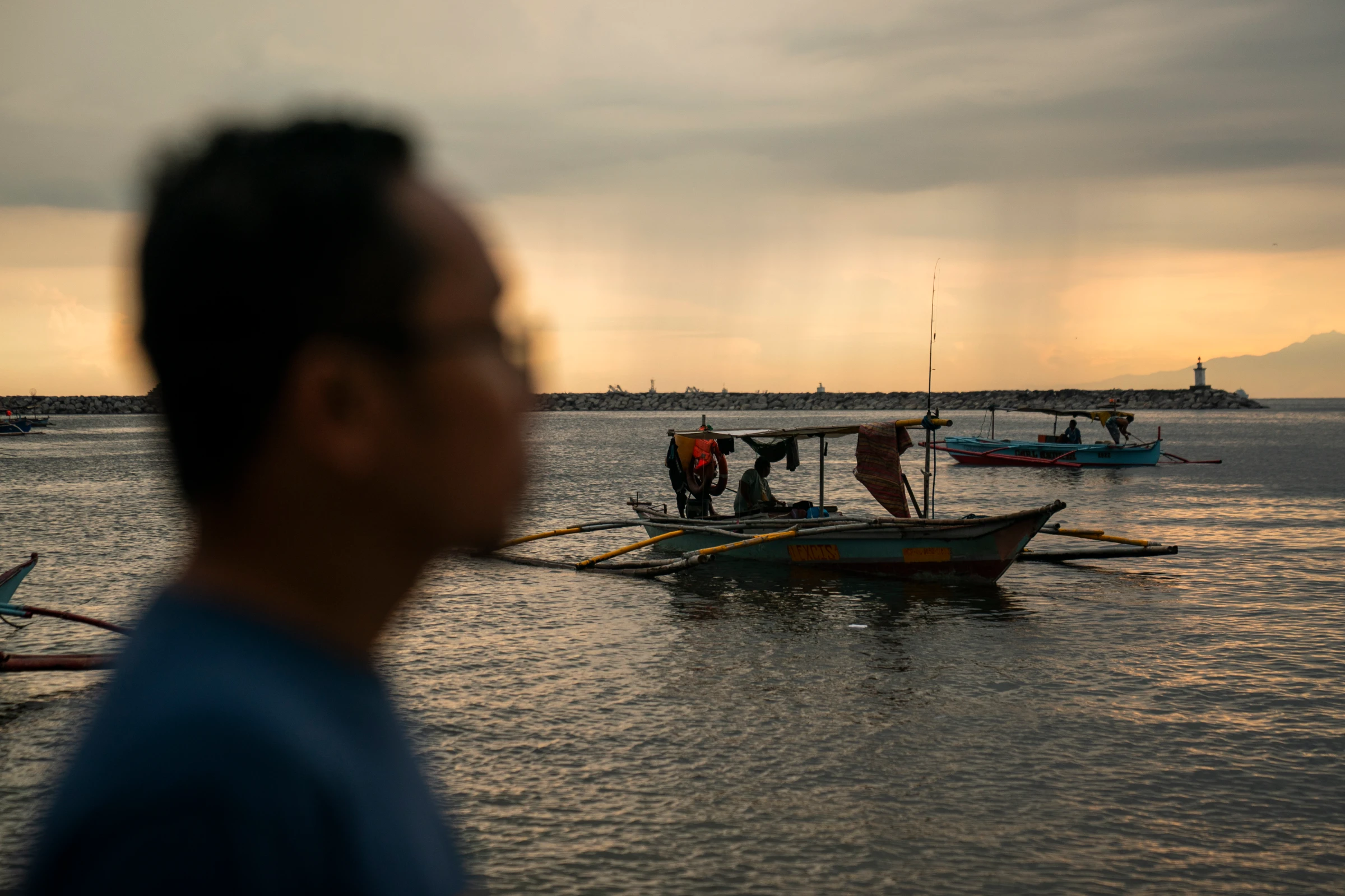 Filipino fisherman Nante Maglangit poses for a photo after an interview, along Manila Bay in Manila, Philippines, May 6, 2025. Thomson Reuters Foundation/Lisa Marie David