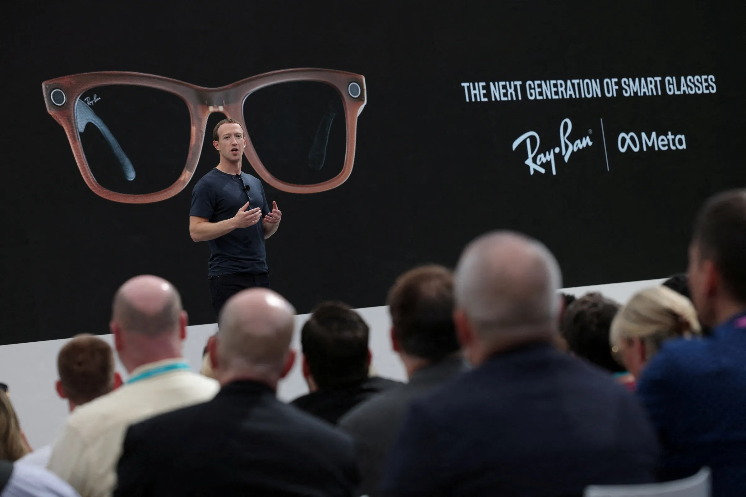 Meta CEO Mark Zuckerberg delivers a speech, as a pair of Ray-Ban smart glasses appear on screen, during the Meta Connect event at the company's headquarters in Menlo Park, California, U.S., September 27, 2023. REUTERS/Carlos Barria
