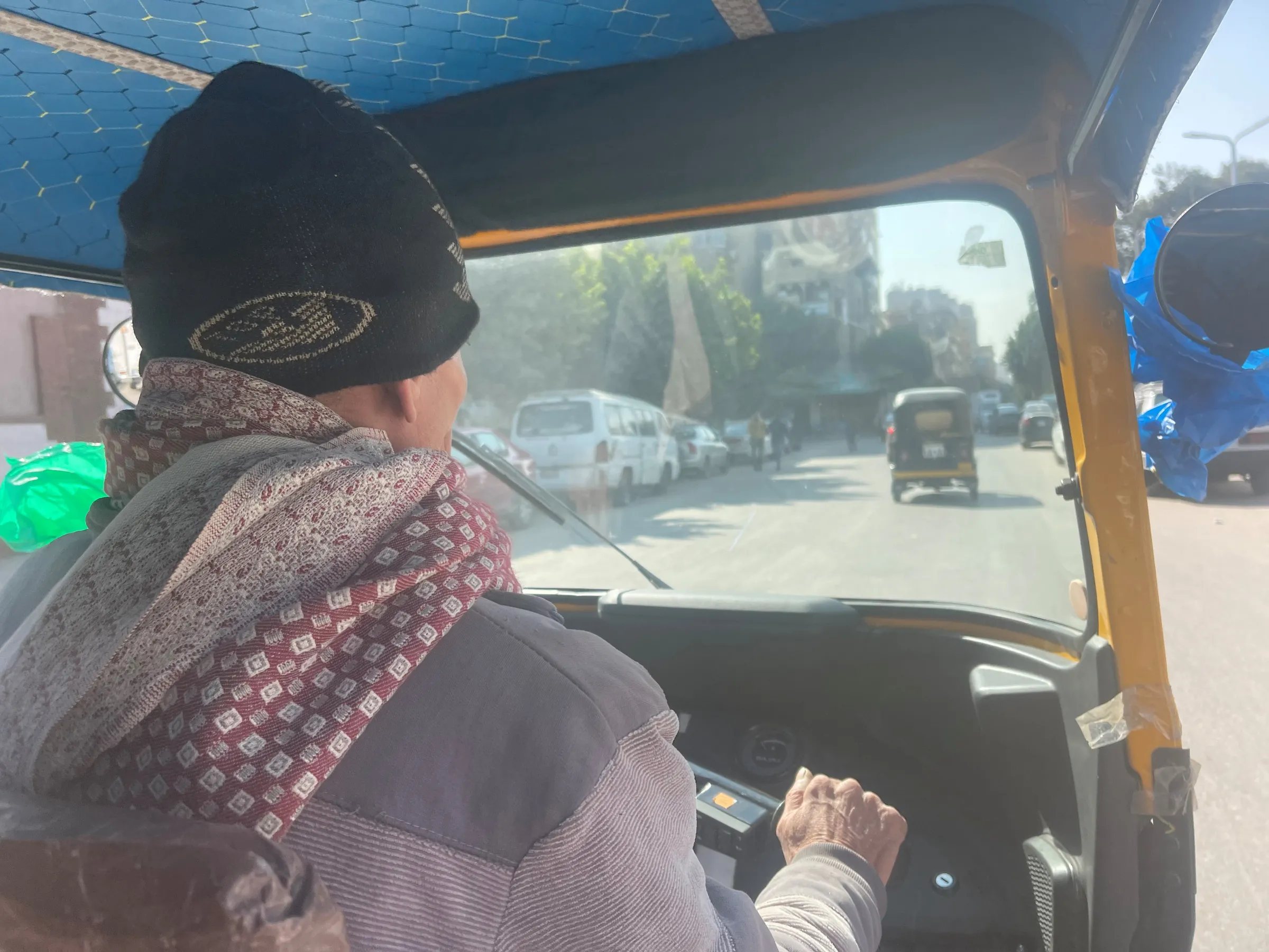 Hisham Ali, 54, drives his tuk-tuk in an eastern Cairo neighbourhood