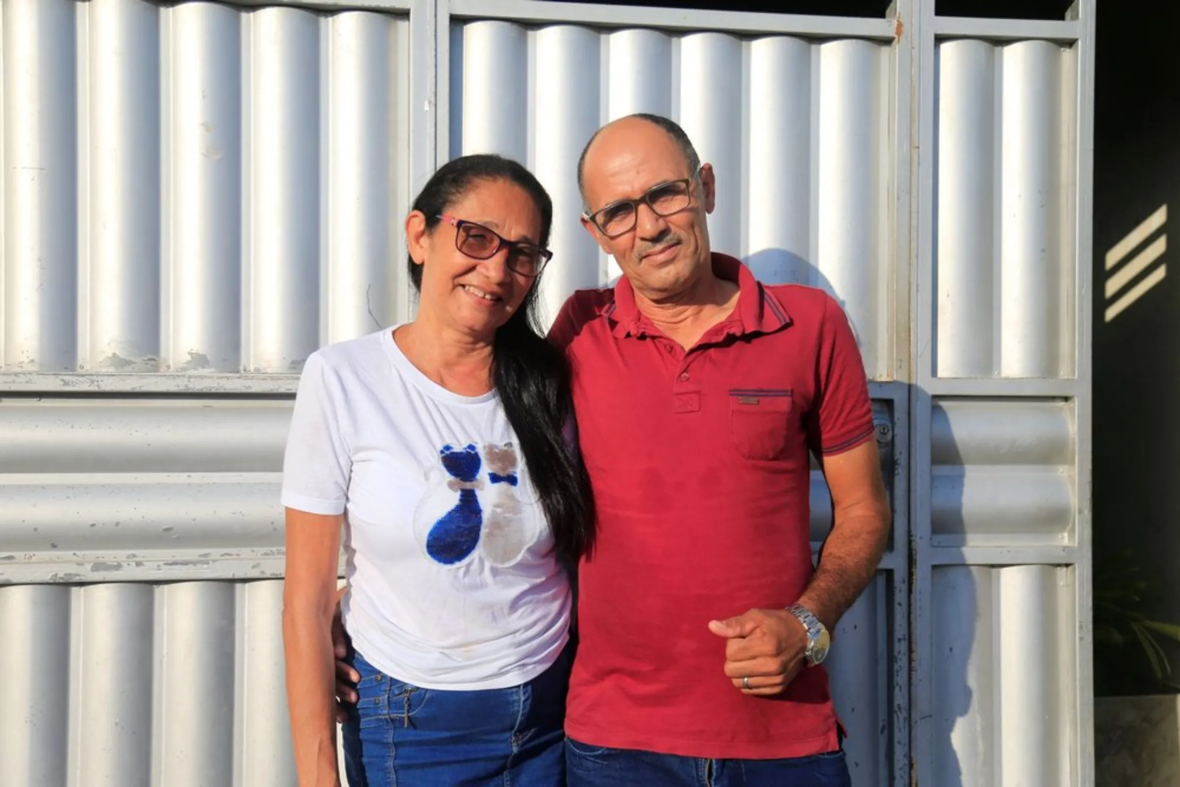 Jose Cicero Lemos, a former sugarcane worker, stands with his wife in Atalaia, Brazil, September 26, 2021
