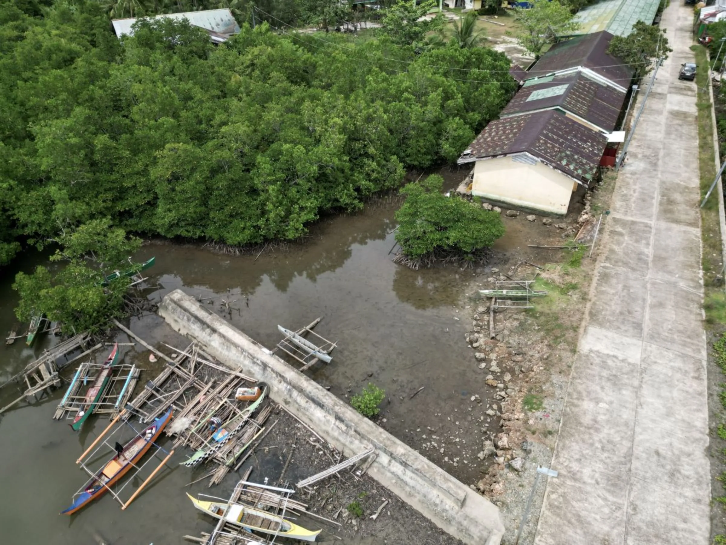 The seawall built after Typhoon Haiyan no longer prevents flood from entering the school in Municipality of Salcedo. The school has been abandoned because of constant flooding.  October 10, 2023. Thomson Reuters Foundation/Kathleen Lei Limayo