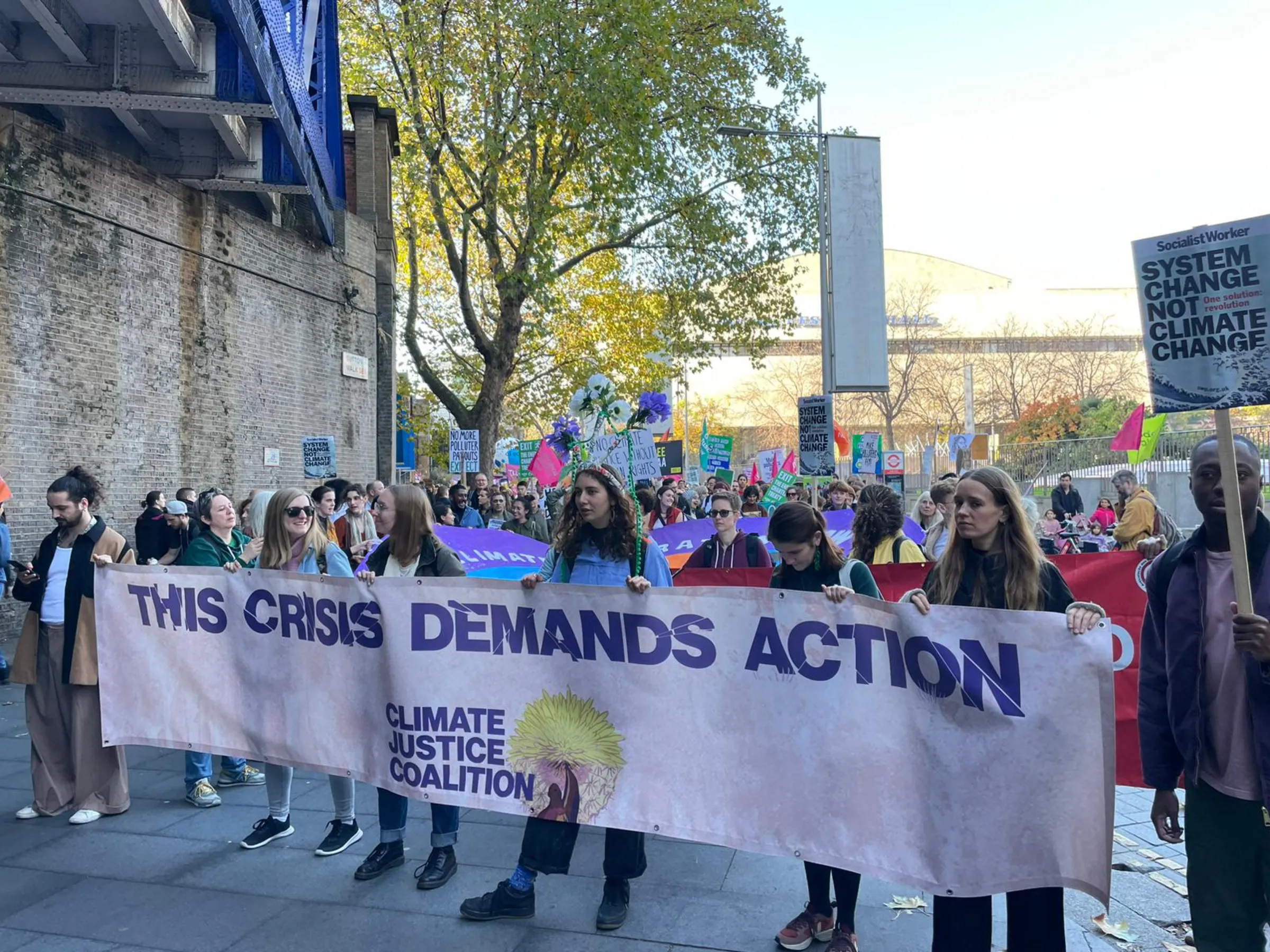 Activists take part in a march to demand climate justice near the headquarters of Shell oil company in London on the Global Day of Action for COP27, November 12, 2022. Thomson Reuters Foundation/Jack Graham