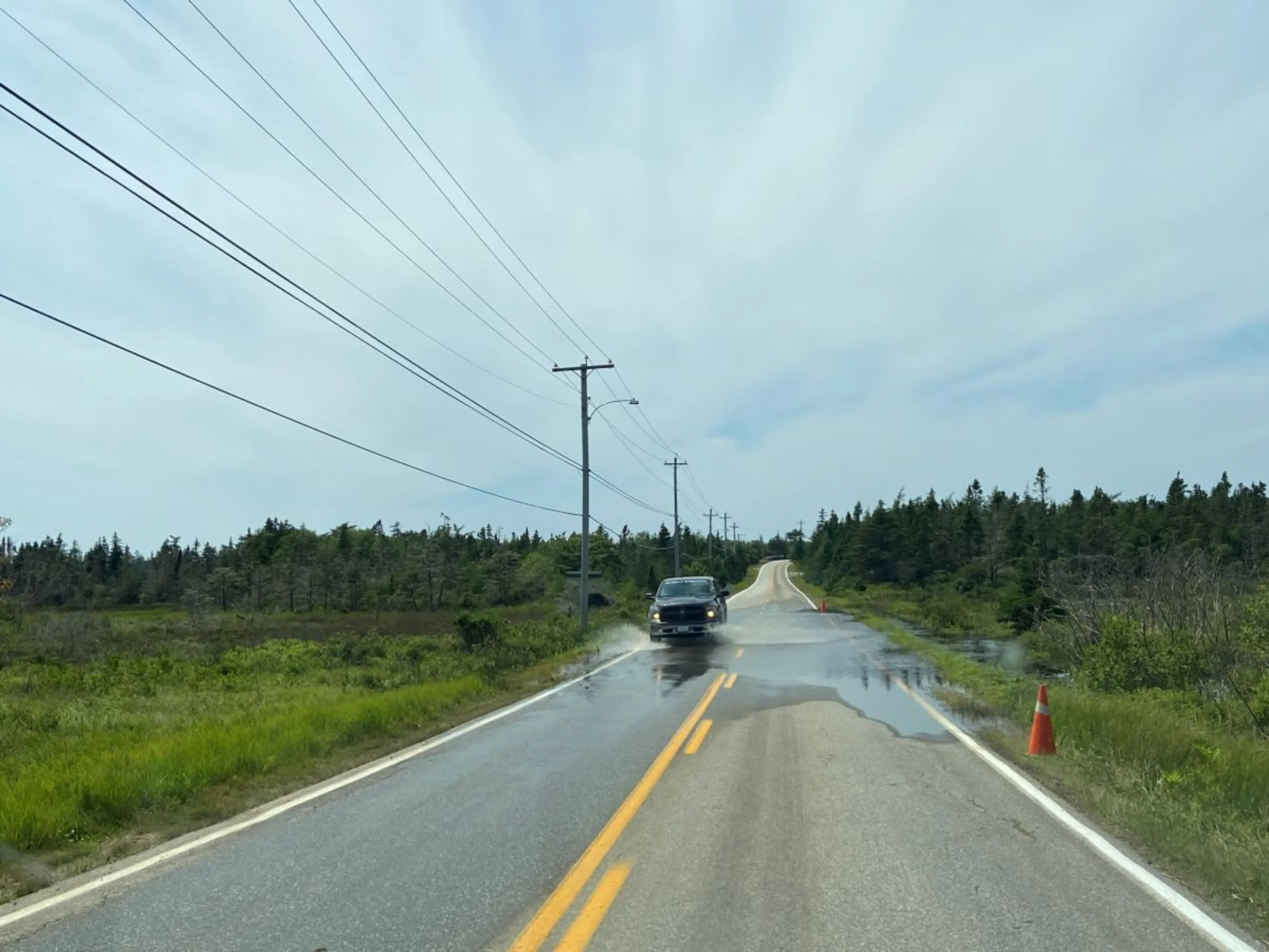 Standing water is pictured near Coastal Grove Farm in Nova Scotia, Canada, July 24, 2023