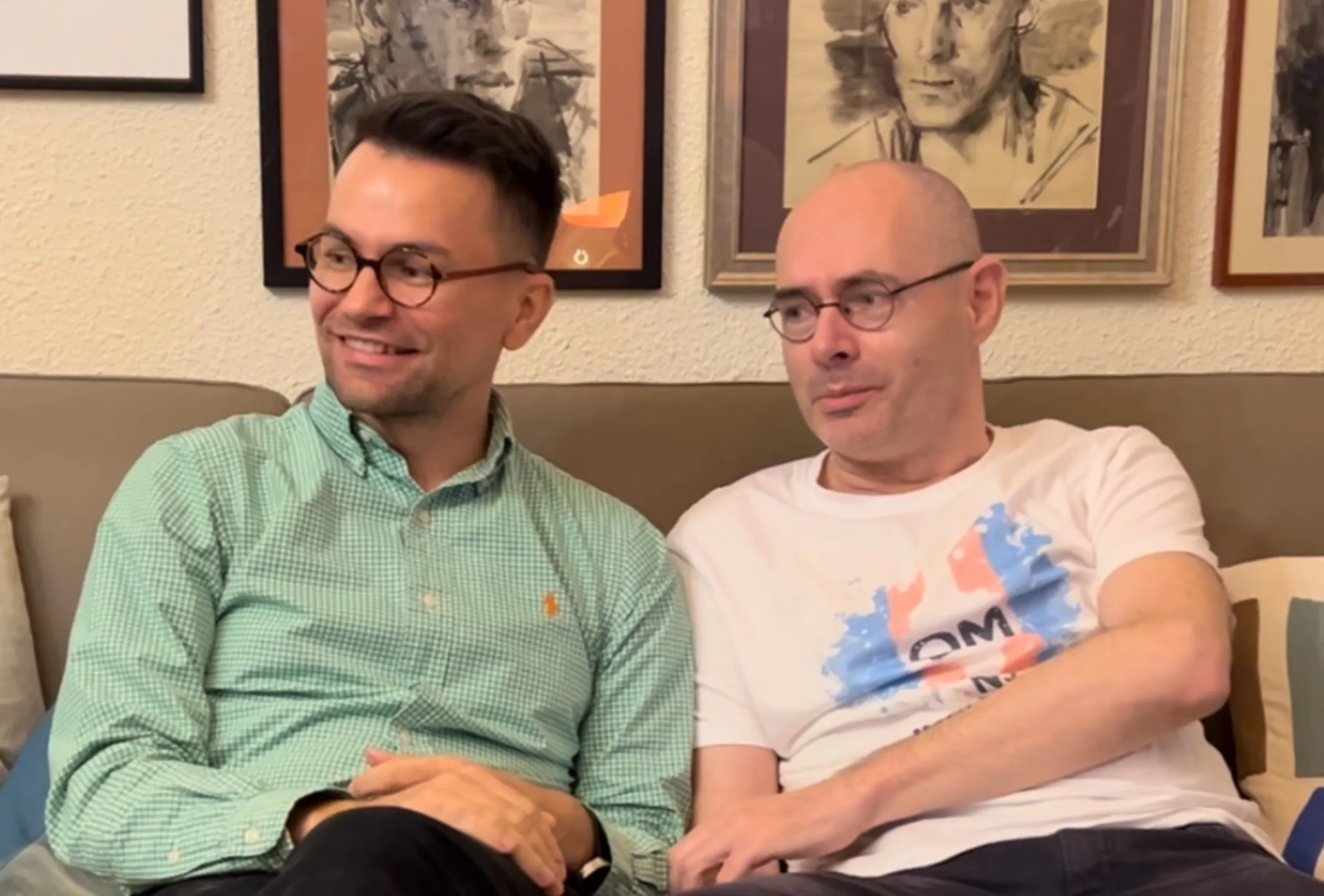 Florin Buhuceanu (right) pictured with his partner Victor Ciobotaru at their home in Bucharest, Romania on October 18. (Thomson Reuters Foundation/Lucy Middleton)