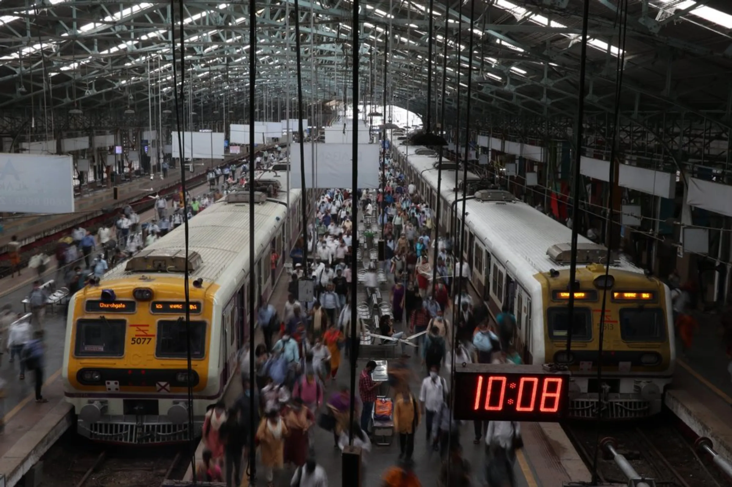 Commuters disembark from suburban trains at Churchgate railway station in Mumbai, India, September 15, 2021