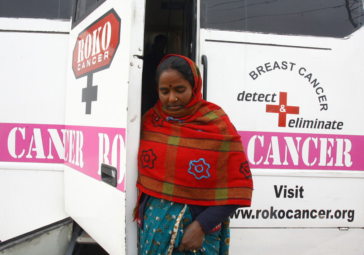 A woman comes out from a mobile cancer detection unit after her mammography examination during a free medical check-up camp in a slum area in the northern Indian city of Chandigarh February 6, 2011