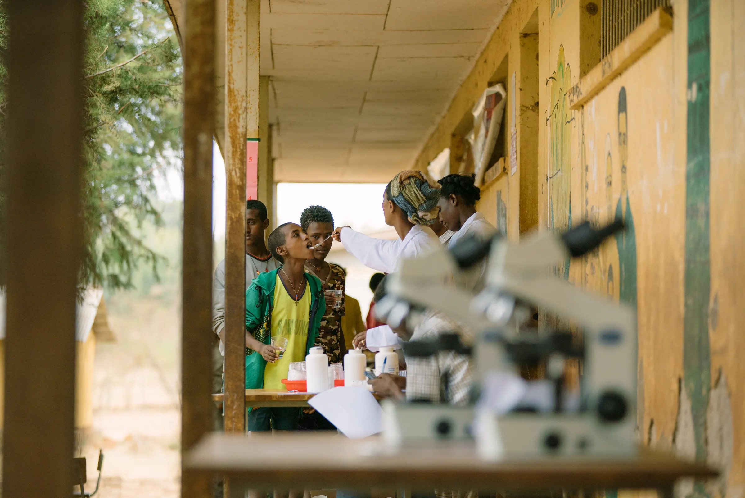 Health workers hand out drugs for schistomosiasis and intestinal worms during a mass treatment campaign in Ethiopia in 2016. Mo Scarpelli/END Fund/Handout via Thomson Reuters Foundation