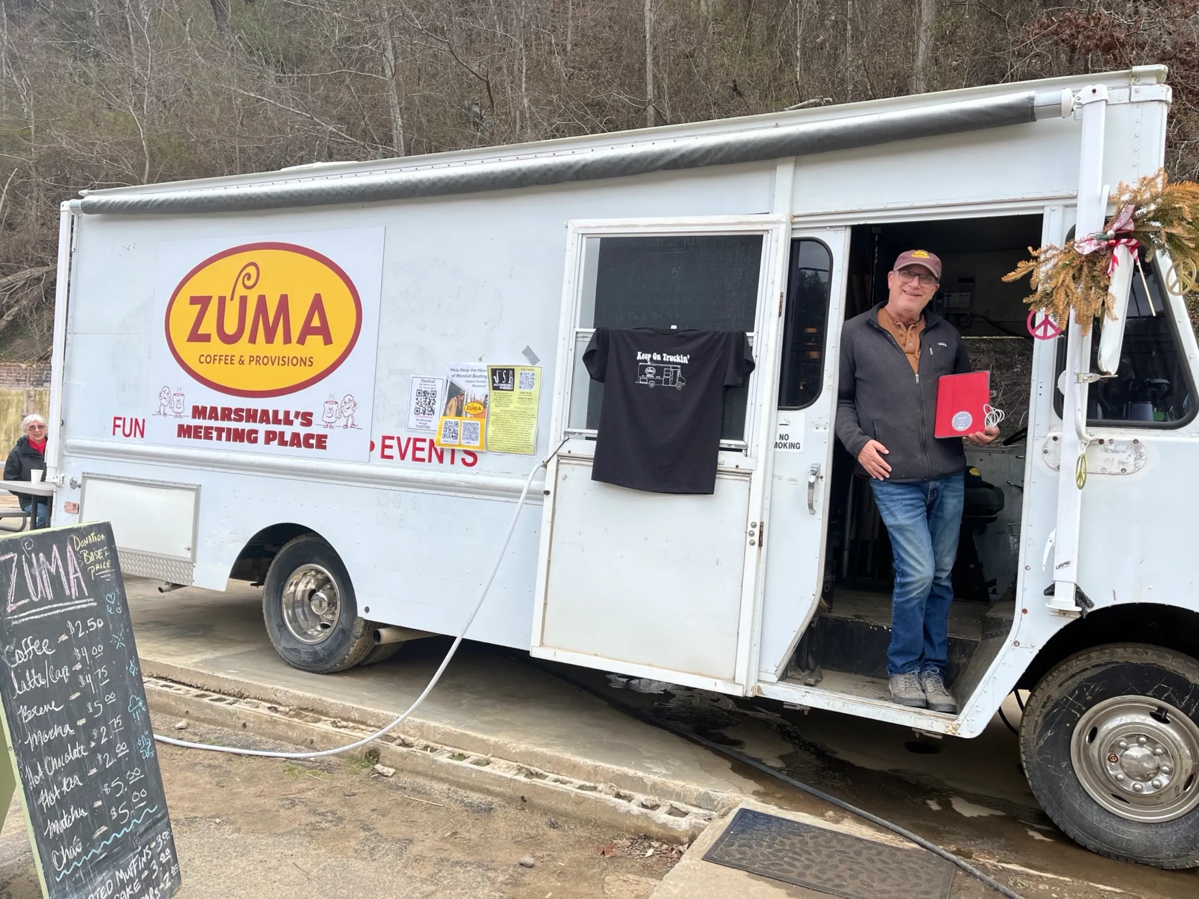 When a local coffee business was destroyed in Hurricane Helene in September 2024, the owner moved his operation to a food truck, using a device from a regional technology recovery program to be able to take credit card payments. Land of Sky Regional Council/Handout via Thomson Reuters Foundation