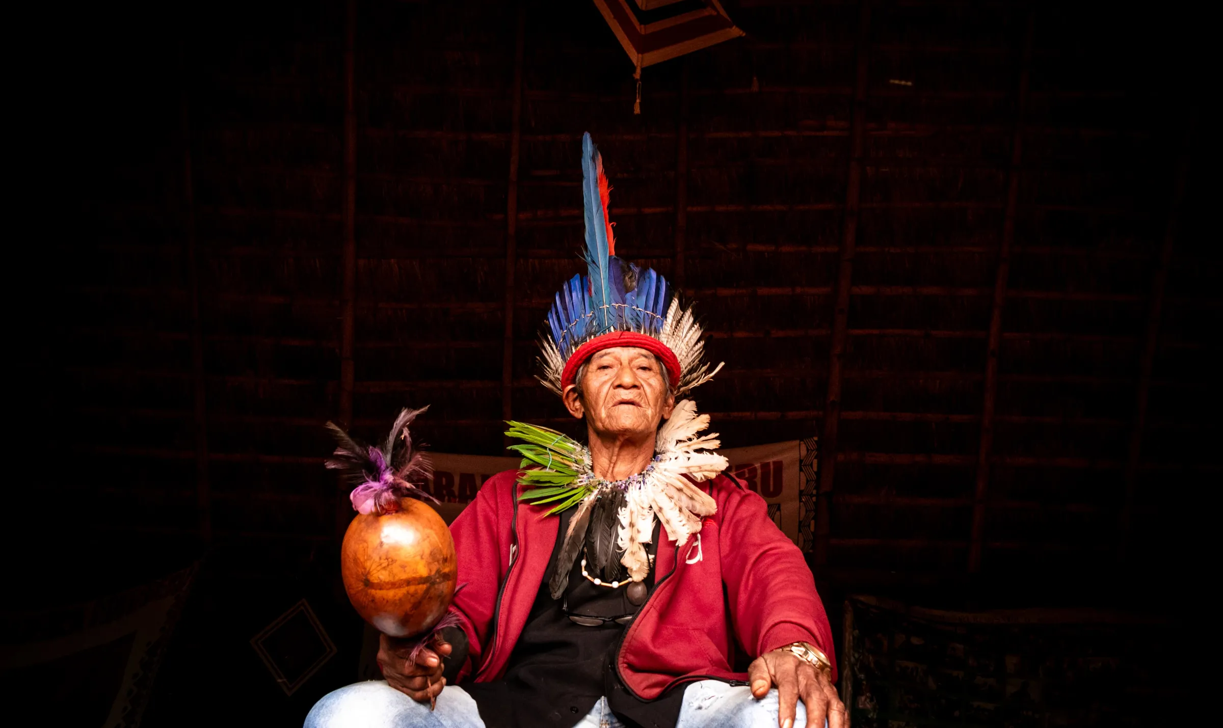 Kaiowá chief Farid Mariano sits for a photo inside the “óga pysy”, a prayer house in the Laranjeira Ñanderu territory, Brazil, September 14, 2024. Thomson Reuters Foundation/Henrique Kawaminami