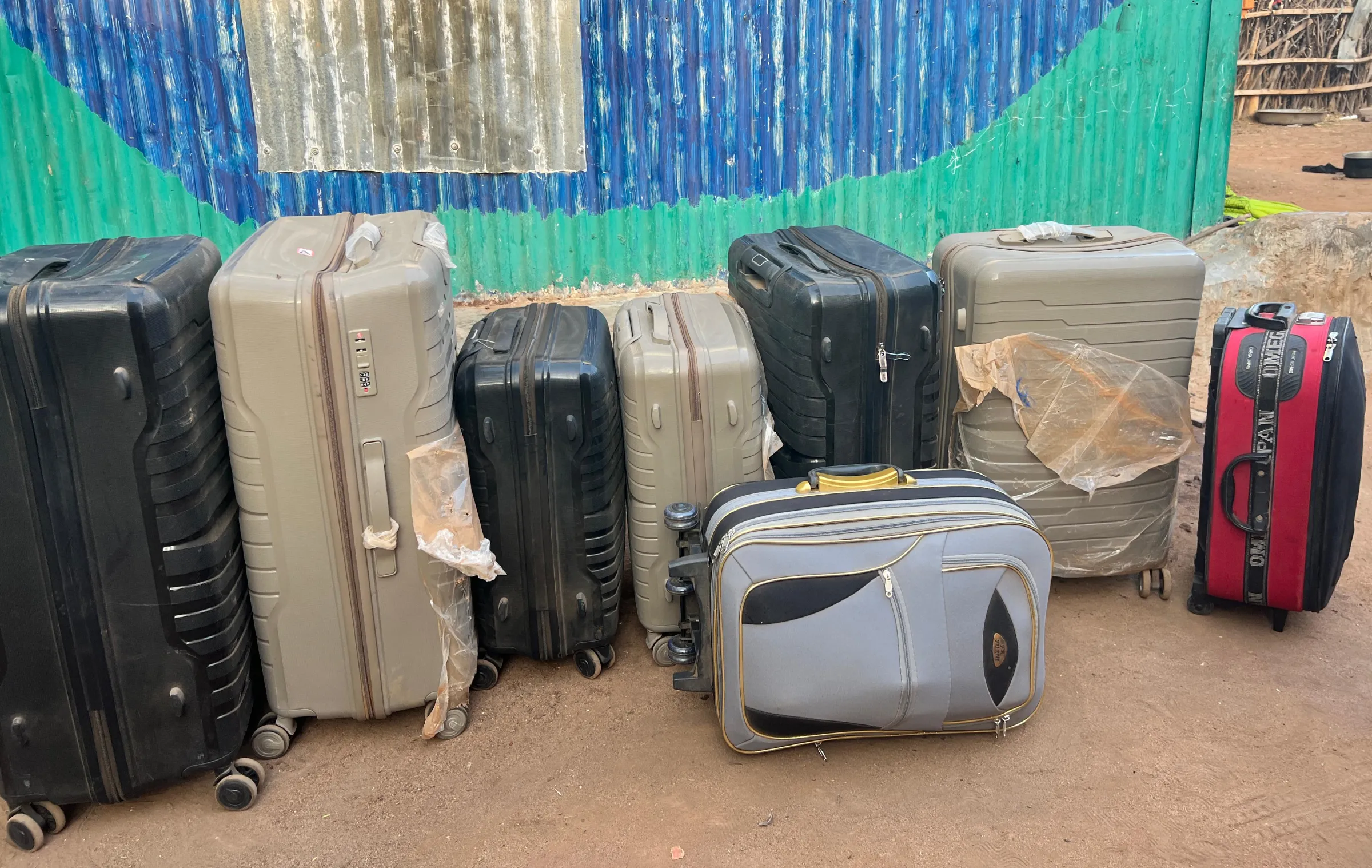 The luggage of a Somali refugee and his family who were scheduled to travel to the United States in January remain packed outside his home in Kenya's Dadaab refugee camp after President Donald Trump halted refugee admissions. Handout via Thomson Reuters Foundation.