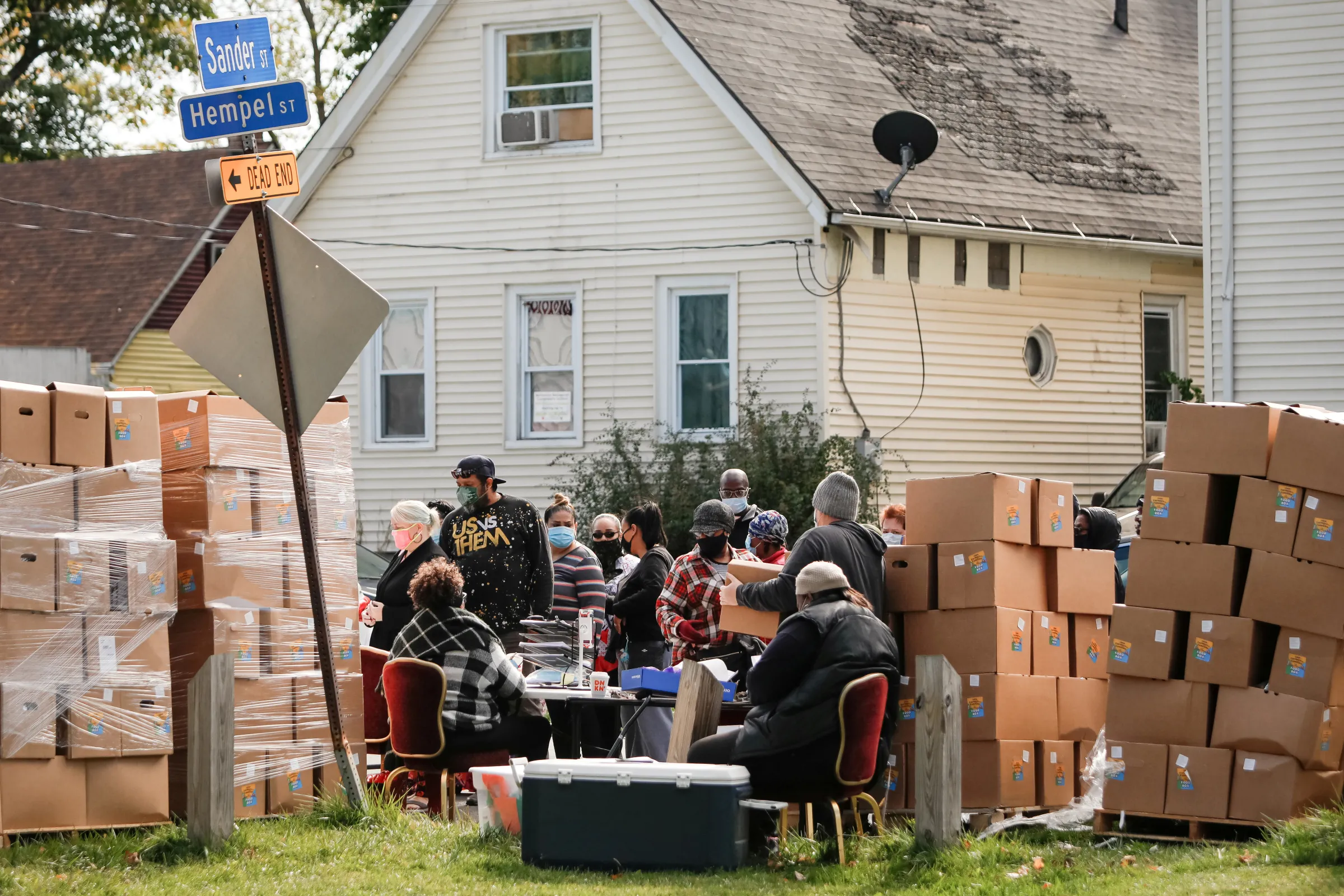 Volunteers distribute fresh food boxes and hand out coronavirus disease (COVID-19) survival kits as part of an outreach program to the Black community to increase vaccine trial participation in Rochester, New York, U.S., October 17, 2020. Picture taken October 17, 2020. REUTERS/Lindsay DeDario