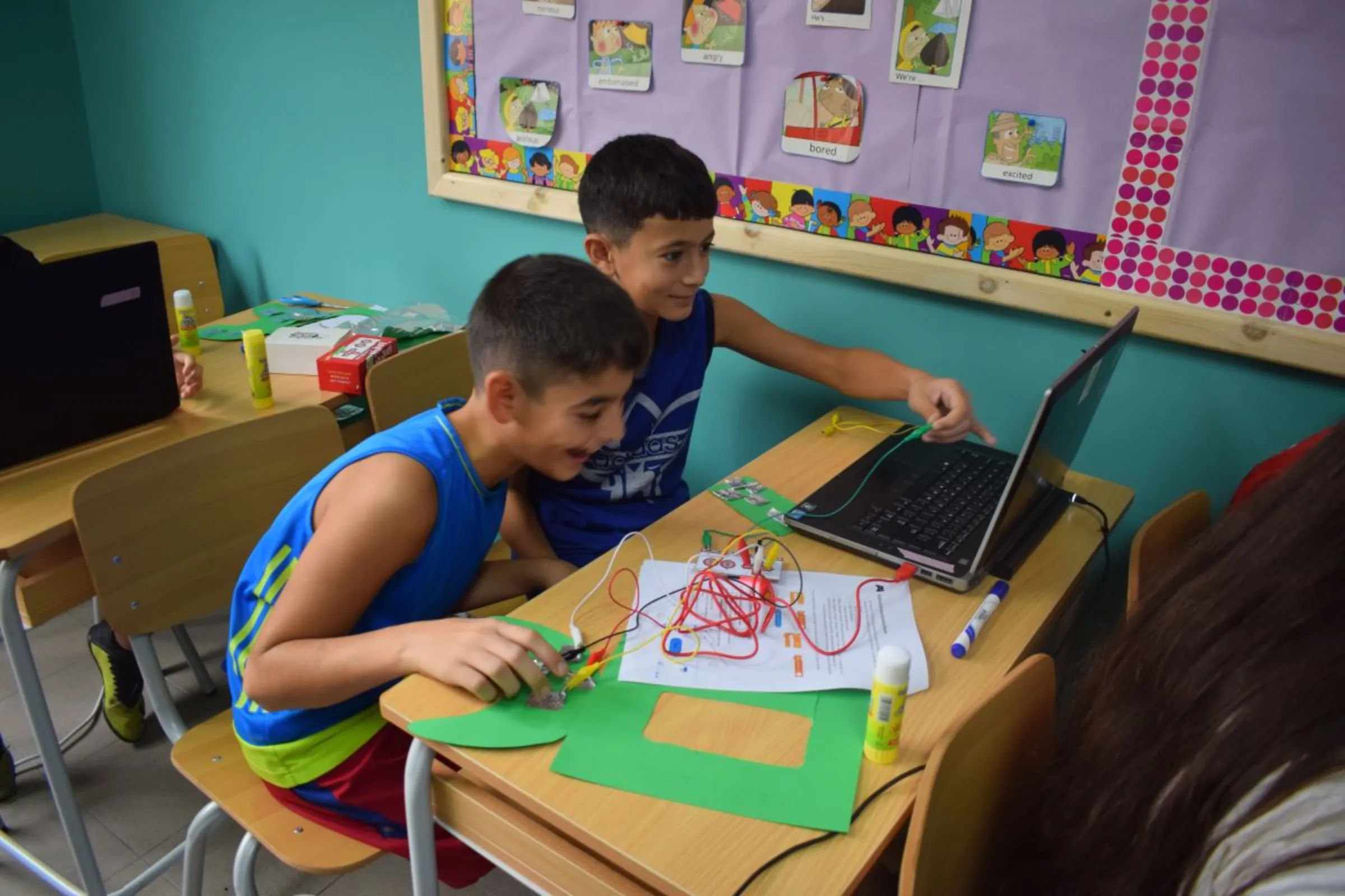 Students learning to code by designing their own game controller device in this undated photo. CodeBrave/Handout via Thomson Reuters Foundation