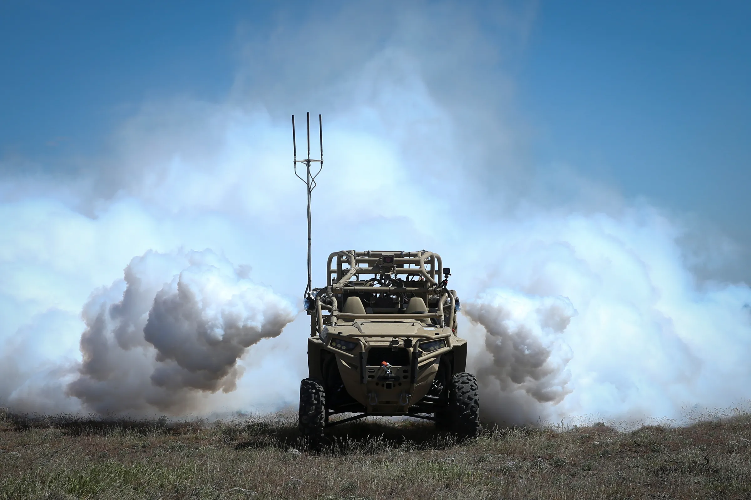 Concealment smoke is activated on a Utility Task Vehicle during the Robotic Complex Breach Concept on Yakima Training Center in Yakima, Washington, U.S. April 26, 2019. U.S. Marine Corps/Lance Cpl. Nathaniel Q. Hamilton/Handout via REUTERS