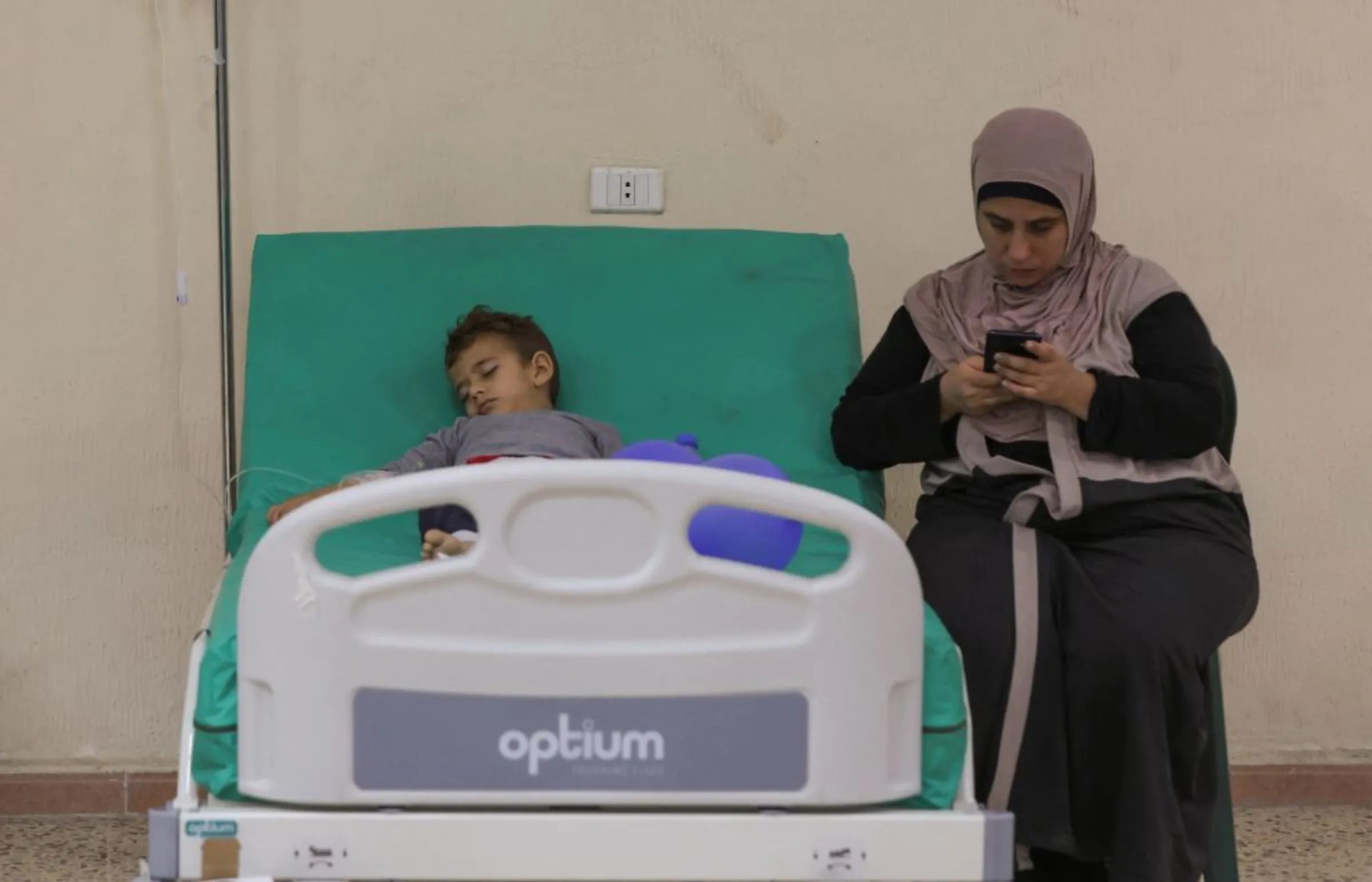 A suspected cholera patient lies on a bed inside a field hospital in Bebnine, Akkar district, northern Lebanon October 28, 2022. REUTERS/Mohamed Azakir