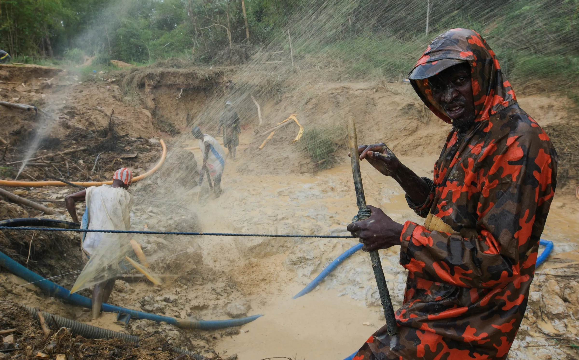 Artisanal miners search for gold in excavated pits at the Prestea-Huni Valley Municipal District in the Western Region, Ghana August 17, 2024. REUTERS/Francis Kokoroko