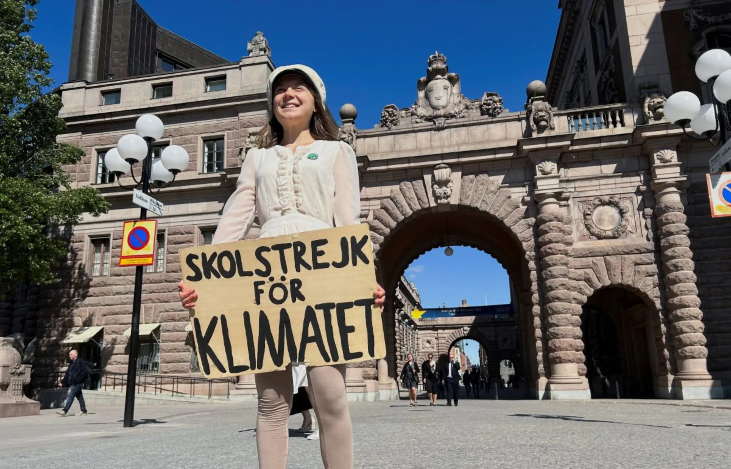 Greta Thunberg stands with a sign that reads, 'School Strike for climate', outside the Swedish Parliament on the day of her weekly protest in Stockholm, Sweden, June 9, 2023
