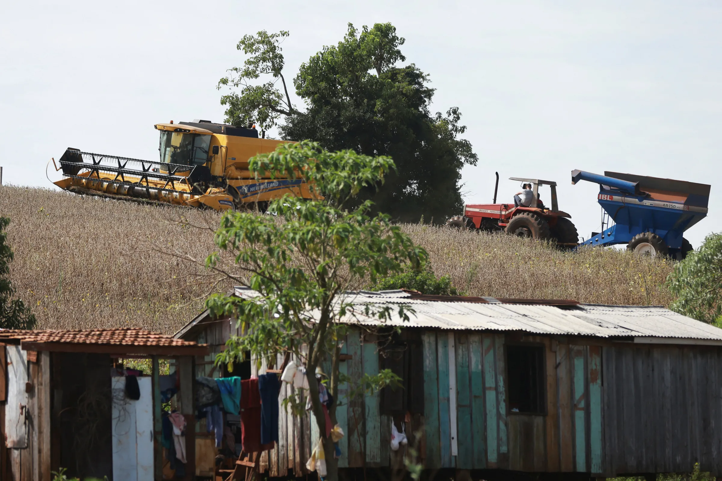 Rural workers use agricultural machinery during soybean harvesting in Nonoai indigenous land, in Nonoai, state of Rio Grande do Sul, Brazil April 4, 2024. REUTERS/Diego Vara
