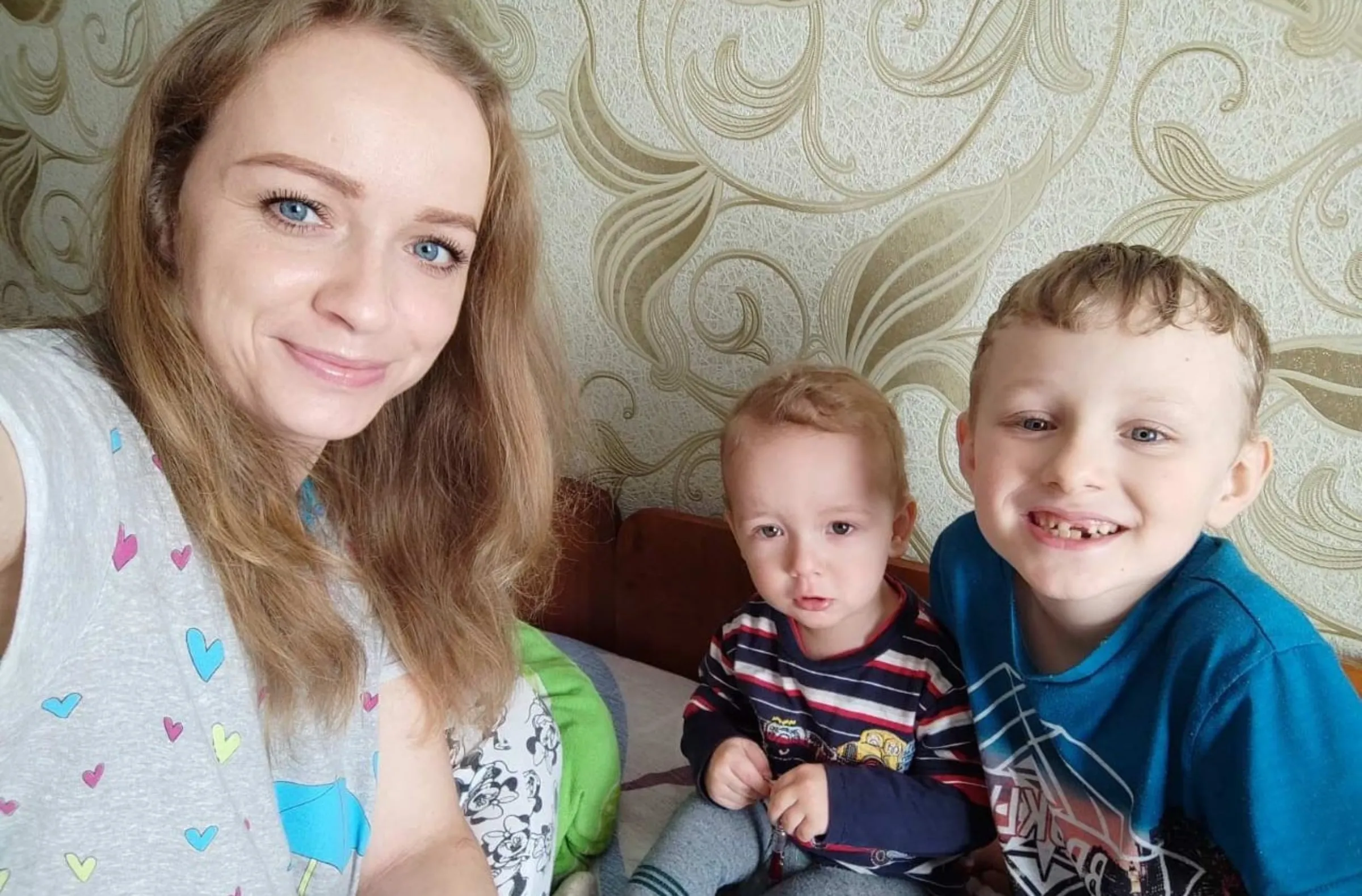 Svitlana Honcharova, 31, is pictured in a selfie taken with her sons Miron, 2, and Dmitry, 5, at their home in Sumy, northeast Ukraine, on March 25, 2022. Thomson Reuters Foundation/Svitlana Honcharova