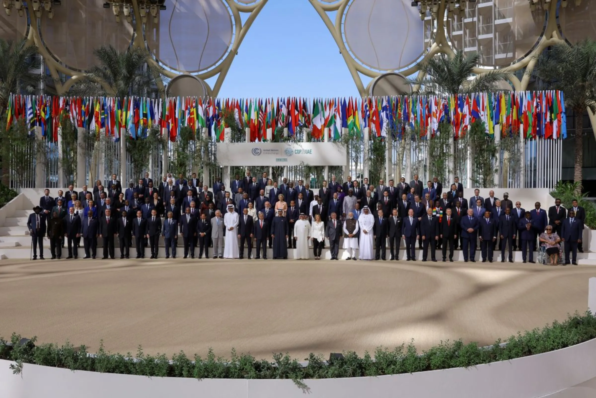 President of the United Arab Emirates Sheikh Mohamed bin Zayed Al Nahyan, Antonio Guterres, Secretary-General of the United Nations, Britain's King Charles, and officials pose for a family photo during the United Nations Climate Change Conference (COP28) in Dubai, United Arab Emirates, December 1, 2023. REUTERS/Amr Alfiky