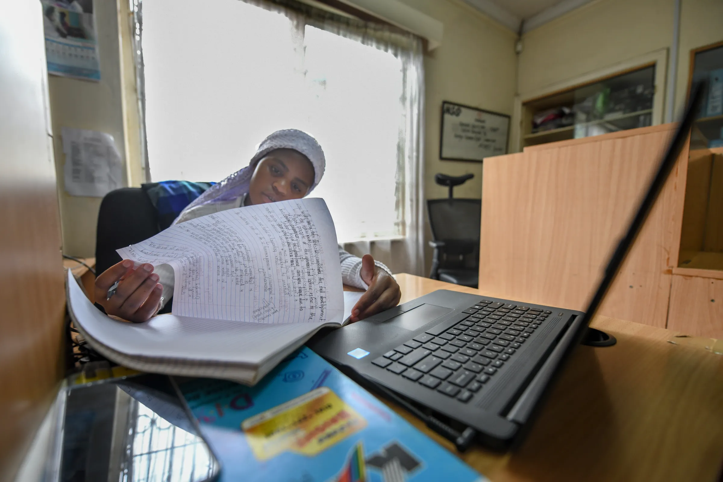 Nosizi Dube, 24, attends a virtual lecture in Nairobi on 4 Nov, 2020. Dube was born stateless into the Shona community in Kenya, but despite the odds has become the first women from her community to graduate from university. UNHCR/Handout via Thomson Reuters Foundation