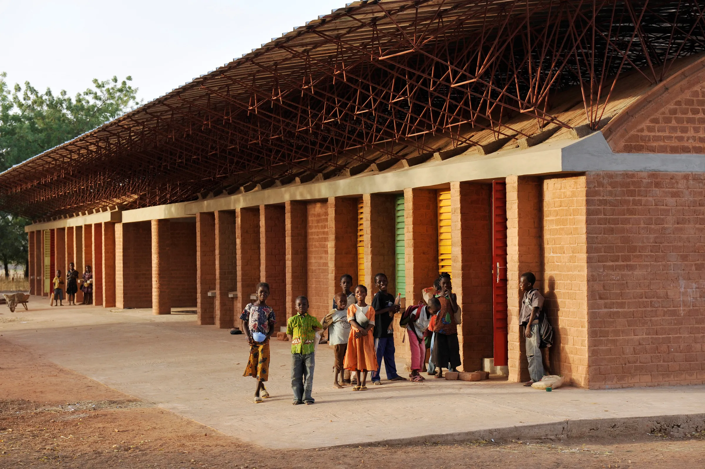 Gando Primary School, designed by Francis Kéré, features a double roof to keep temperatures cool inside. Kéré Architecture/Handout via Thomson Reuters Foundation