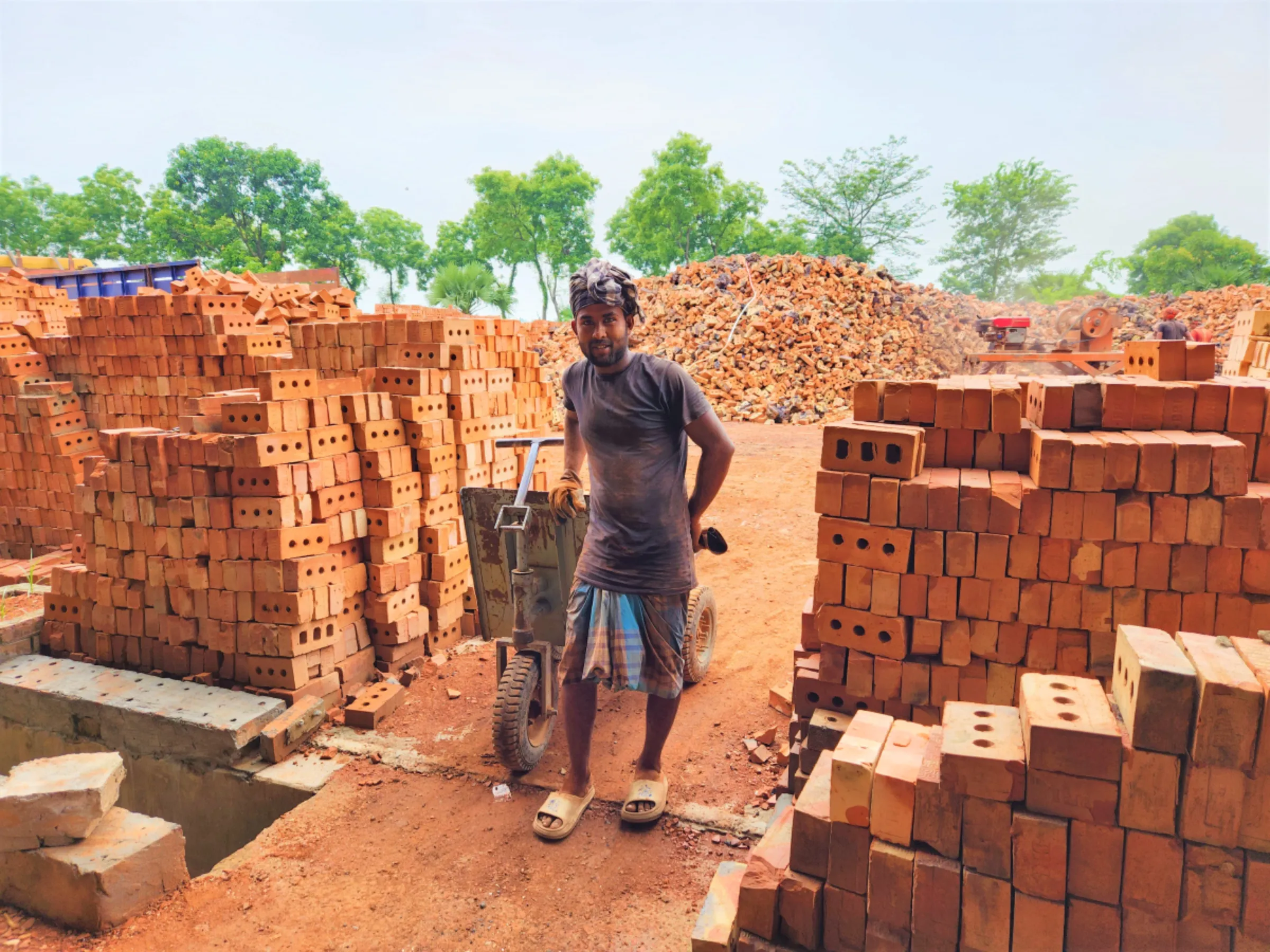 Worker Rafiqul Islam was carrying burned bricks at Banolata Bricks Refractory Ltd. When he started to work at Banolata he found everything was systematic, machine oriented and totally risk and dust free. Natore, Northern Bangladesh June 30, 2023