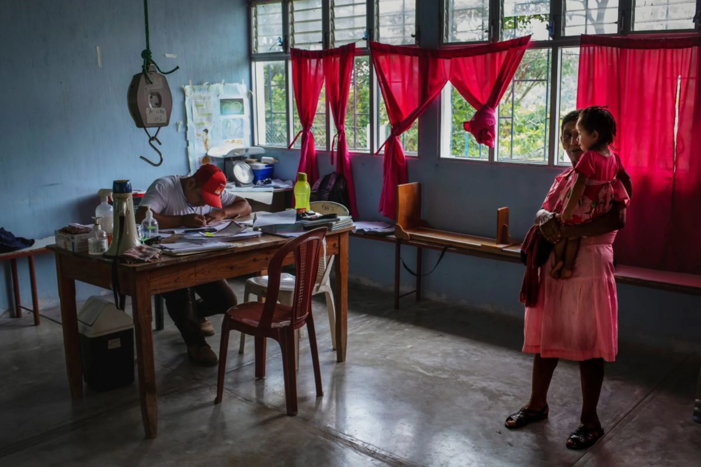 A government nurse makes a record of a malnourished child’s height and weight a medical check-up in a remote rural clinic in the Camotán municipality in the province of Chiquimula, Guatemala, September 8, 2023. Thomson Reuters Foundation / Fabio Cuttica