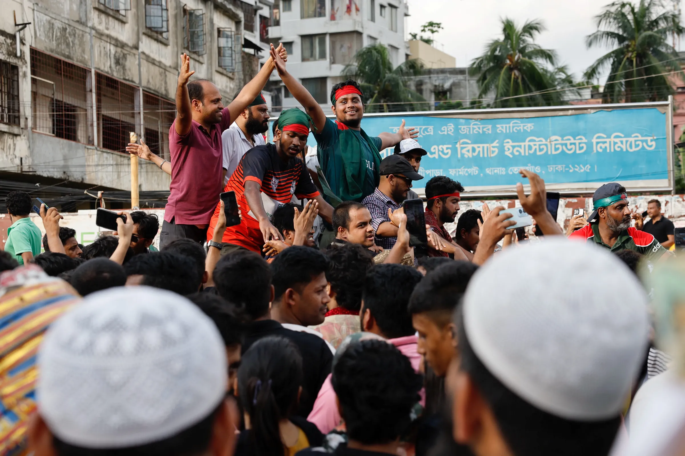 People celebrate the resignation of the Prime Minister Sheikh Hasina with the coordinators of anti-quota protests, in Dhaka, Bangladesh, August 5, 2024. REUTERS/Mohammad Ponir Hossain