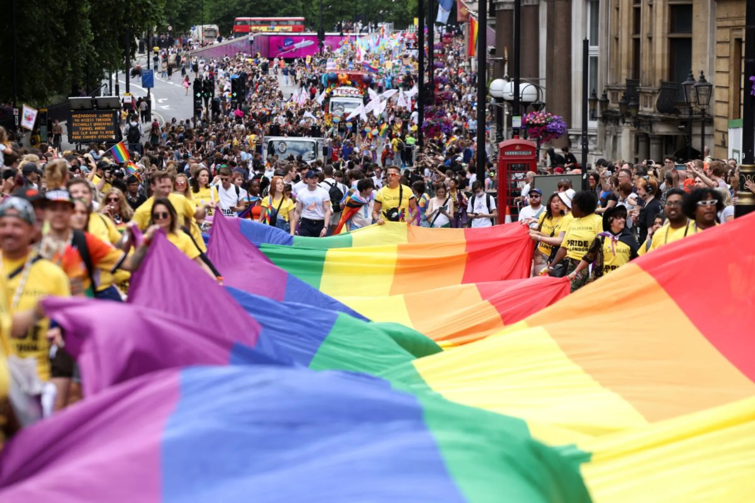 People carry a large rainbow flag, as they take part in the 2022 Pride Parade in London, Britain July 2, 2022. REUTERS/Henry Nicholls