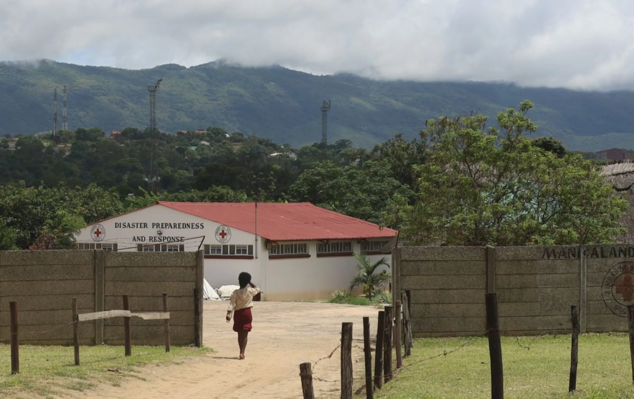 A student on a nurse aide course enters a Red Cross centre in Mutare, Zimbabwe. January 5, 2024. Thomson Reuters Foundation/Farai Shawn Matiashe