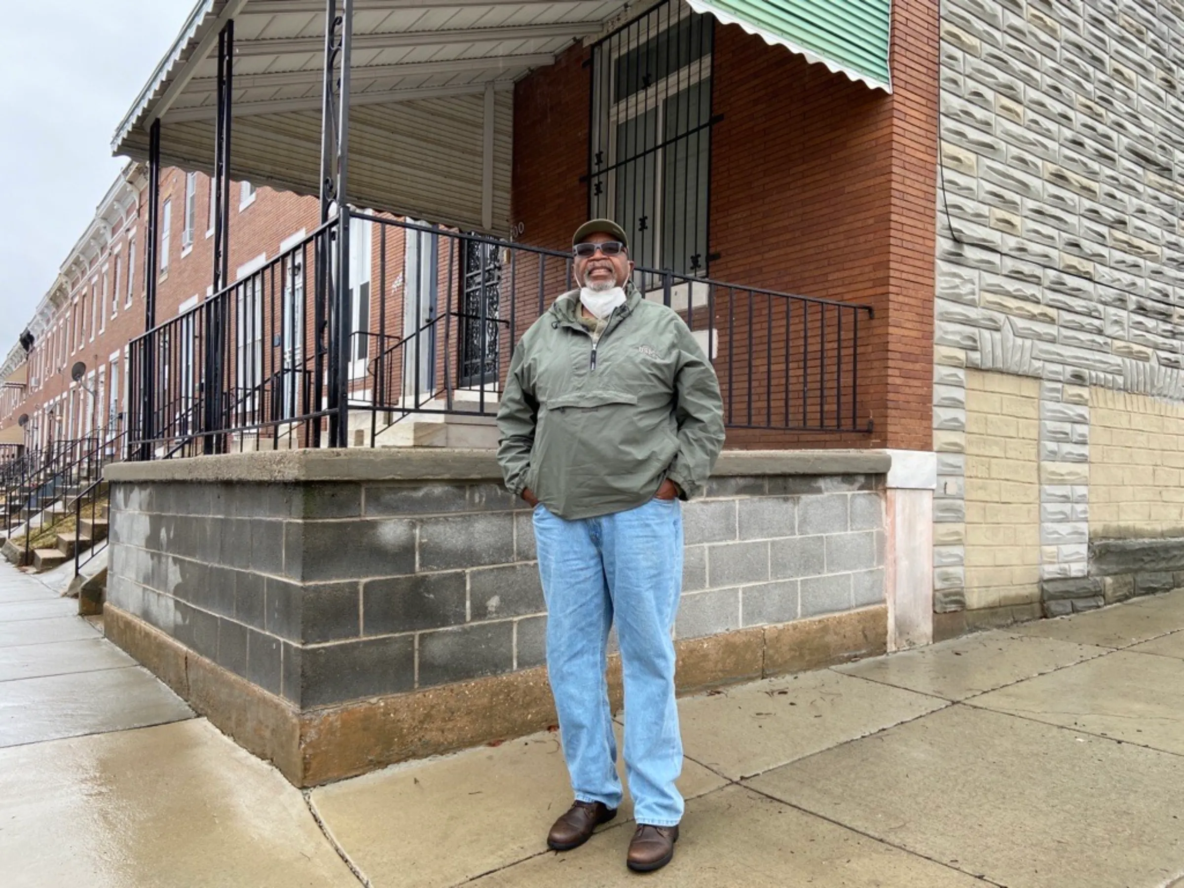 Glenn Smith stands outside his old address on Lauretta Avenue in west Baltimore