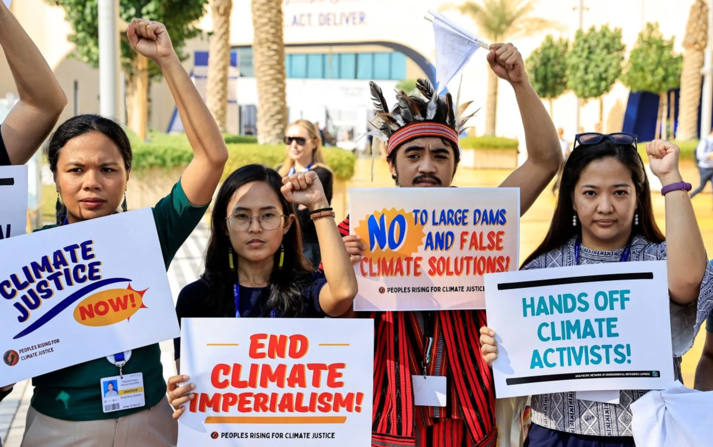 Activists hold placards and shout slogans during a protest, at the United Nations Climate Change Conference COP28 in Dubai, United Arab Emirates, December 6, 2023