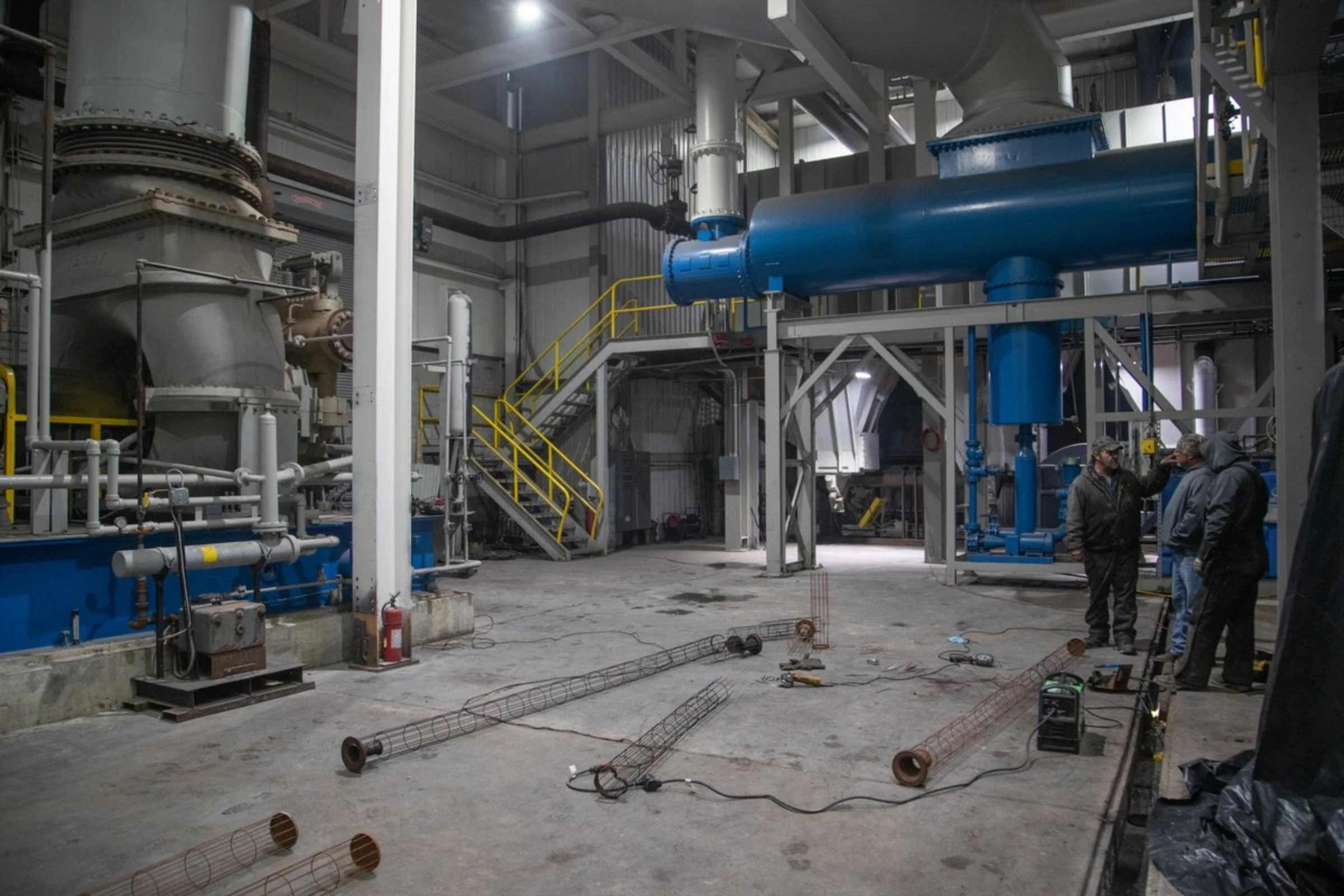 Workers are seen at a waste gasification site in Inez, Kentucky, January 25, 2022. Thomson Reuters Foundation/Amira Karaoud