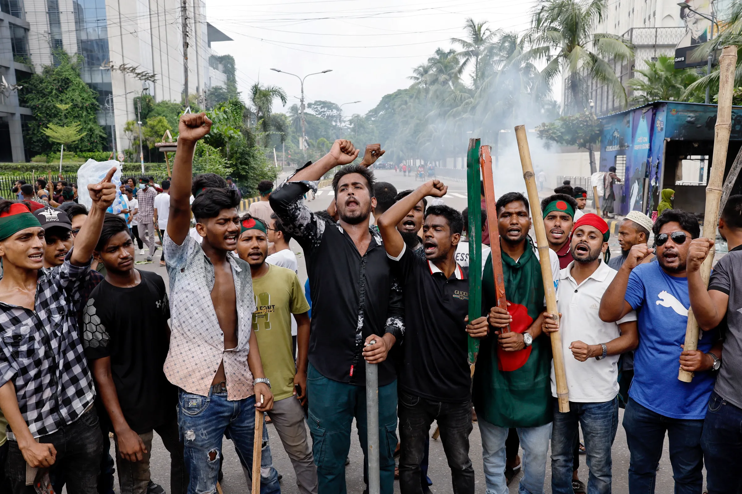 Demonstrators shout slogans after they have occupied a street during a protest demanding the stepping down of Bangladeshi Prime Minister Sheikh Hasina, following quota reform protests by students, in Dhaka, Bangladesh, August 4, 2024. REUTERS/Mohammad Ponir Hossain