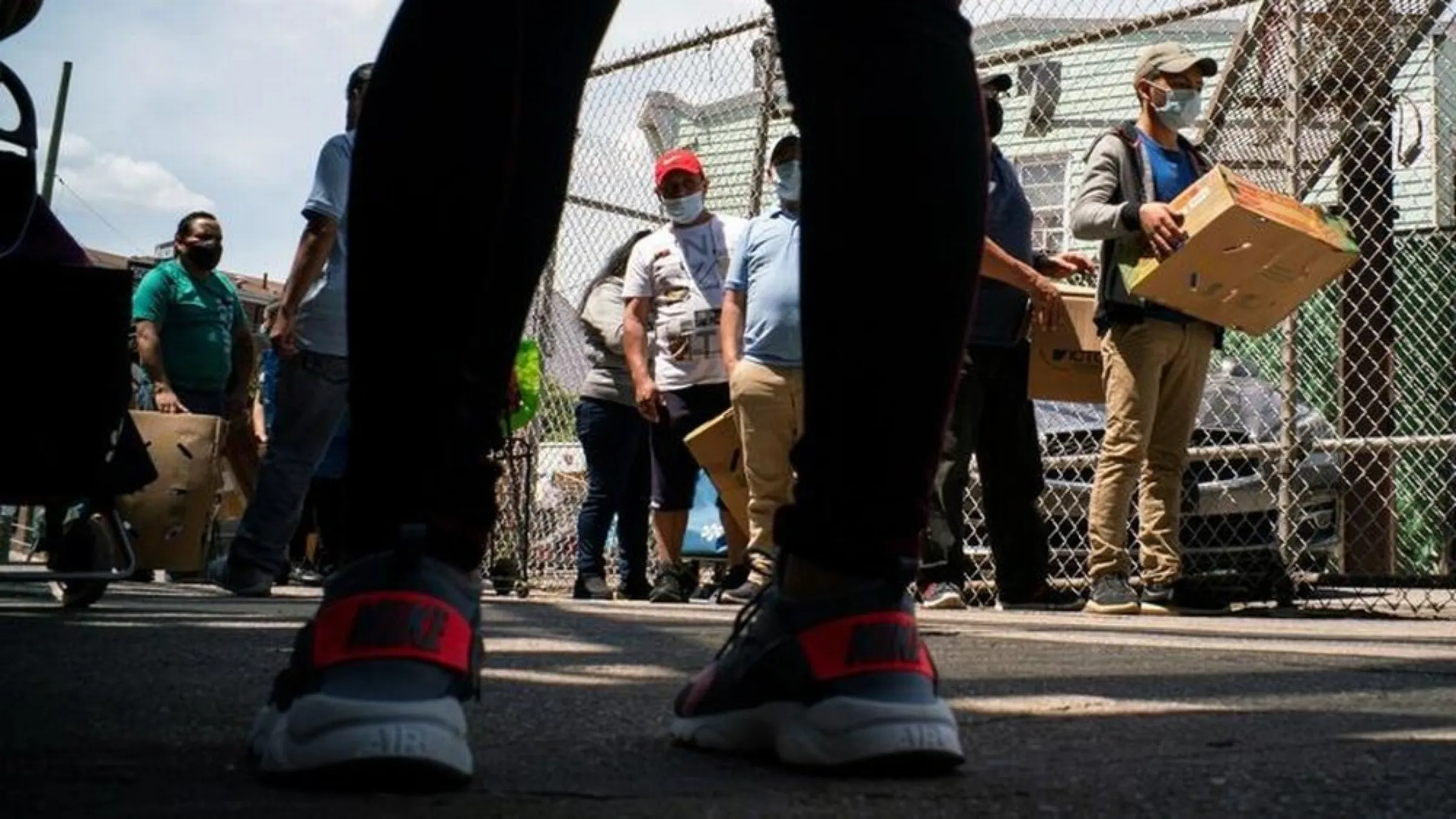 People queue during a food distribution during the outbreak of the coronavirus disease (COVID-19) in the Corona section of Queens, New York City, New York, U.S., May 16, 2020