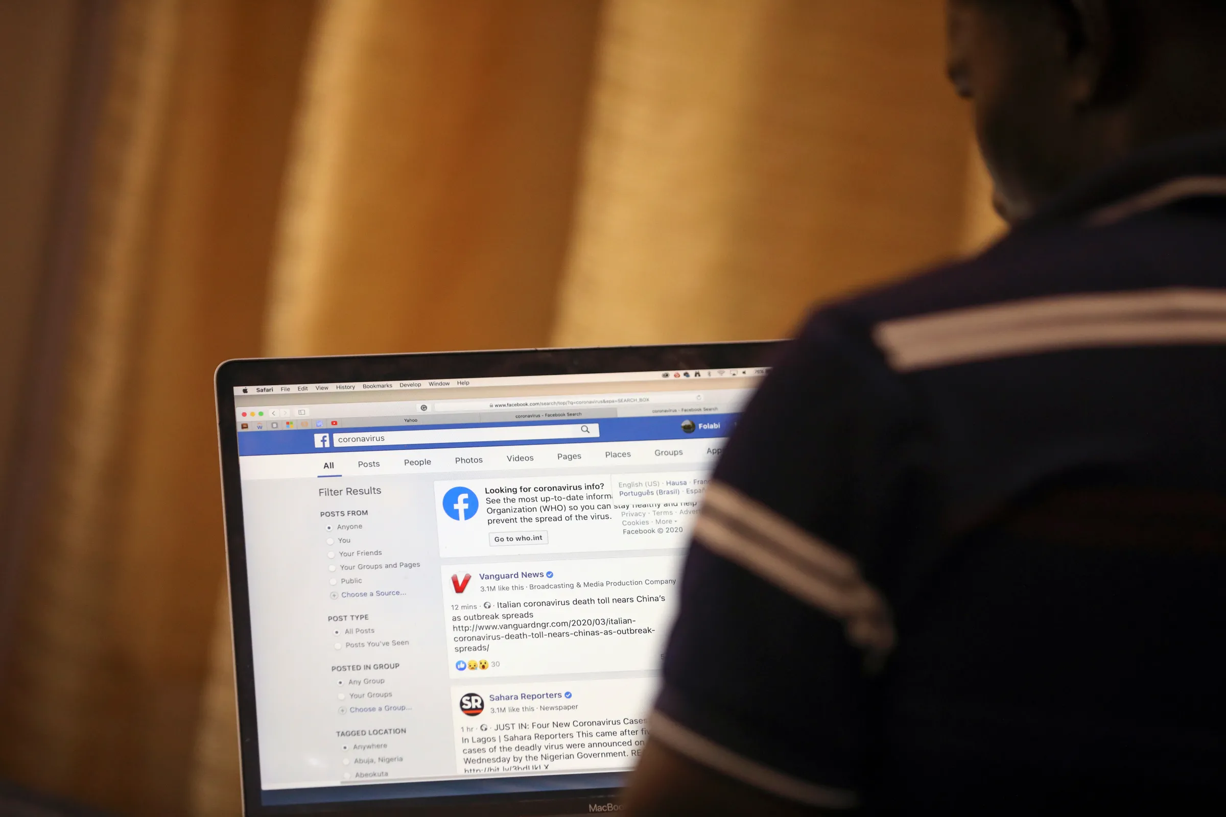 A man opens the Facebook page on his computer to fact check coronavirus disease (COVID-19) information, in Abuja, Nigeria March 19, 2020.