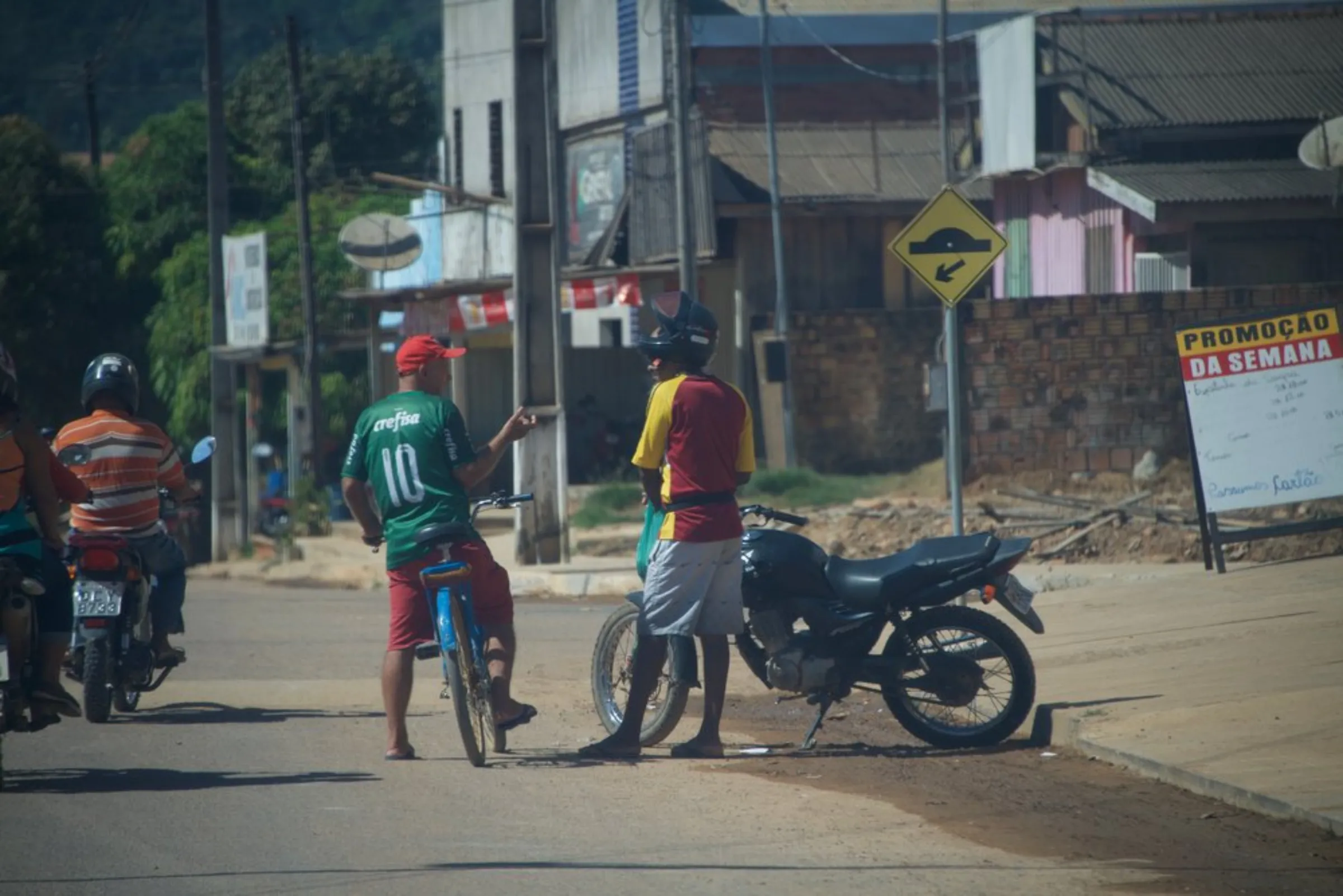 Locals talk in the street in Colniza, in the state of Mato Grosso, Brazil, May 31, 2022