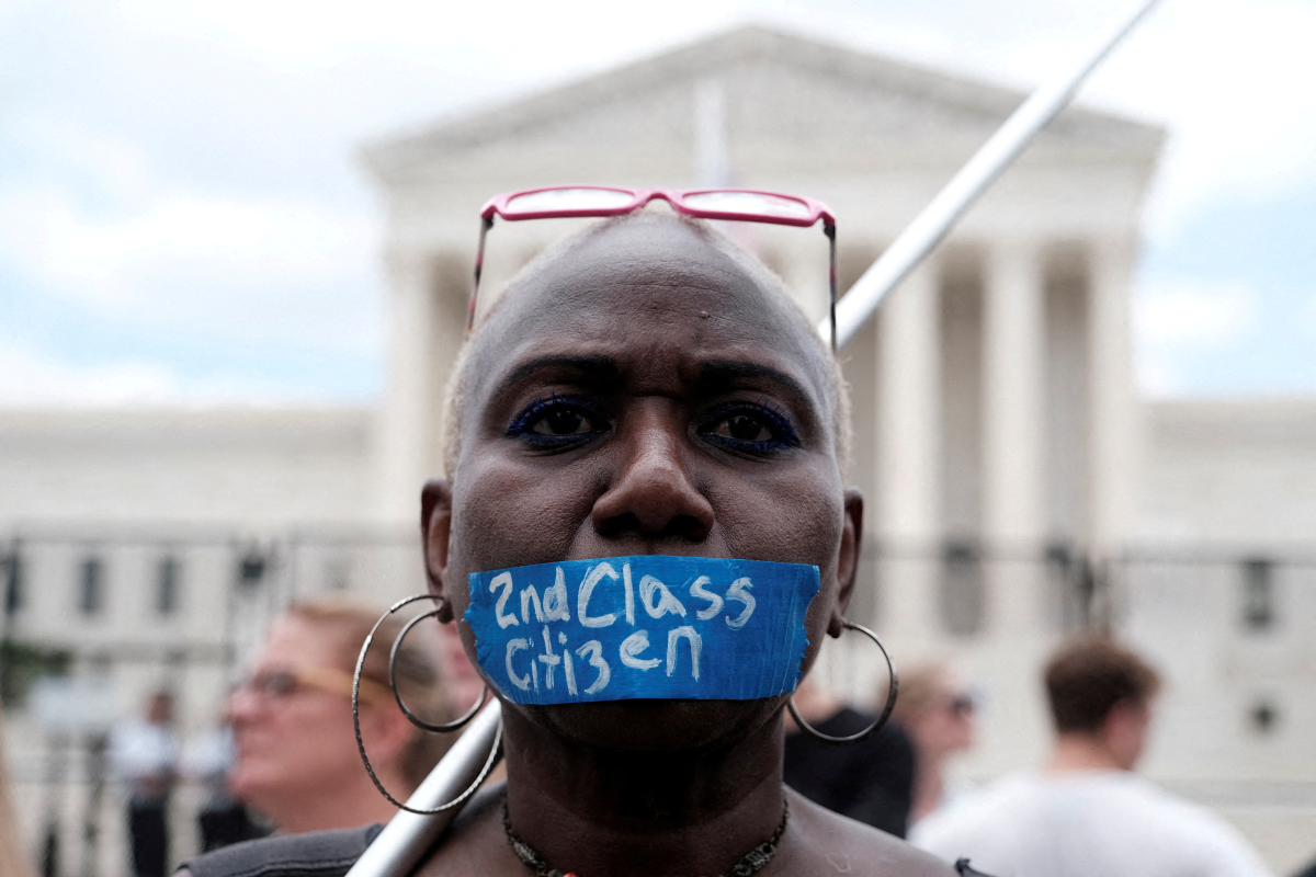 Abortion rights demonstrator tapes her mouth outside the United States Supreme Court as the court rules in the Dobbs v Women's Health Organization abortion case, overturning the landmark Roe v Wade abortion decision in Washington, U.S., June 24, 2022