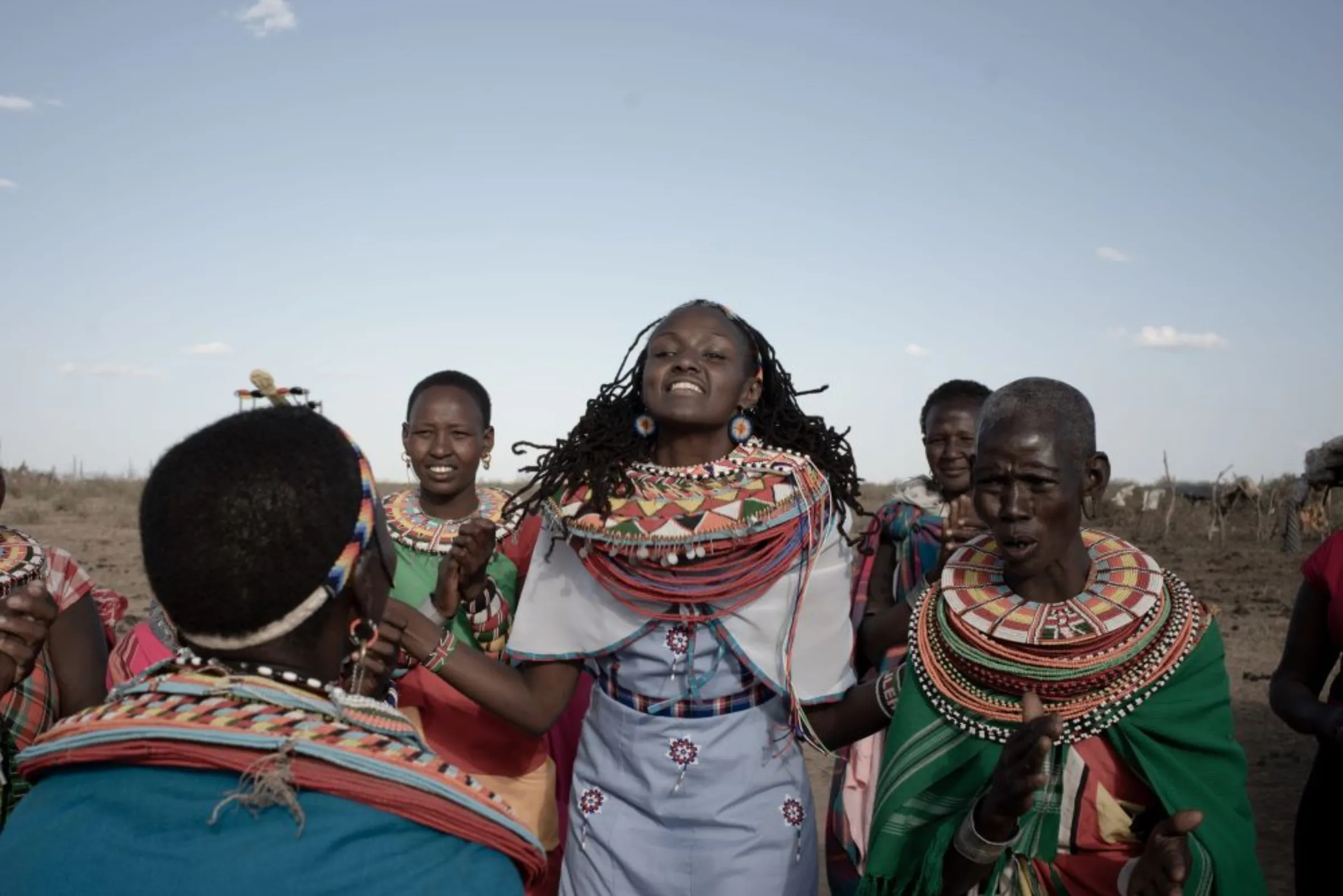 Kenyan girls’ rights campaigner Josephine Kulea, founder of Samburu Girls Foundation, performs a welcome dance with others in her community for Nimco Ali in Maralal, northern Kenya, in 2019