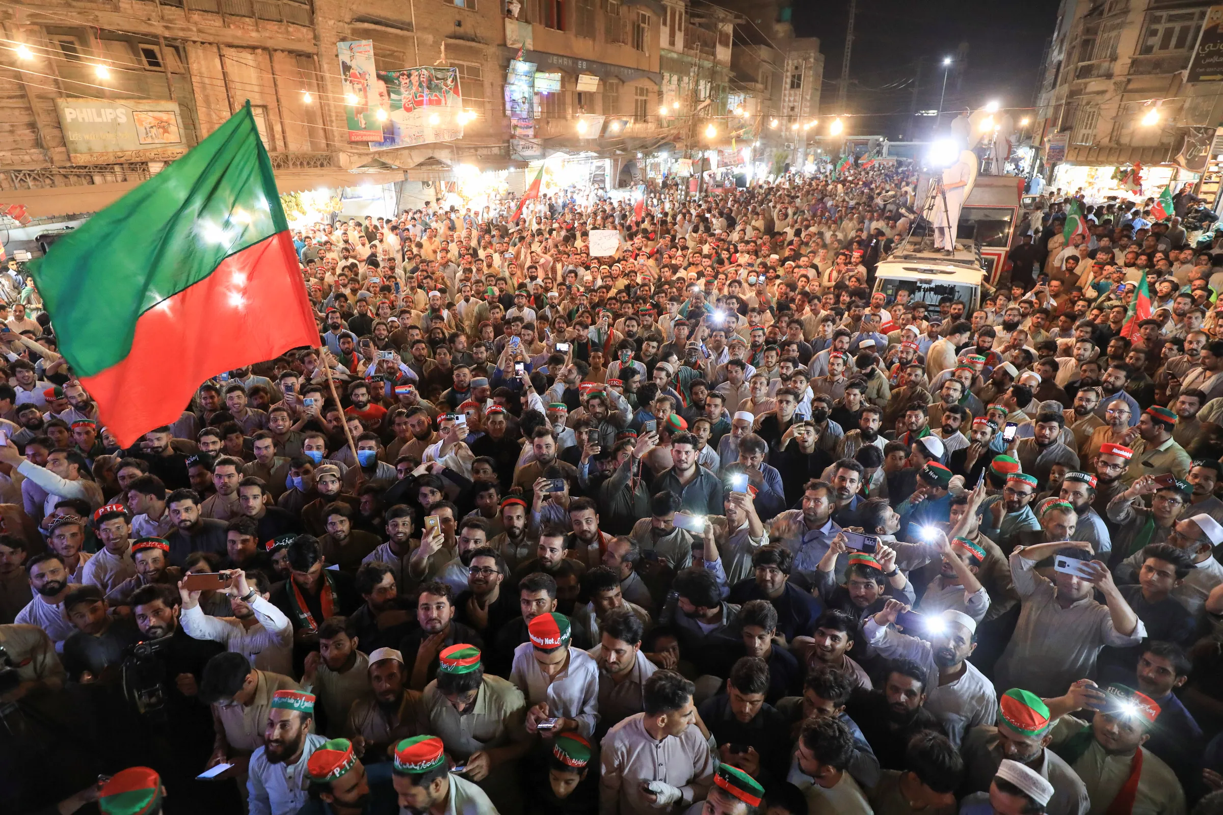 Supporters of the Pakistan Tehreek-e-Insaf (PTI) political party gather to listen the virtual address of the ousted Prime Minister Imran Khan, during a countrywide protest on inflation, in Peshawar, Pakistan June 19, 2022. Picture taken June 19, 2022. REUTERS/Fayaz Aziz